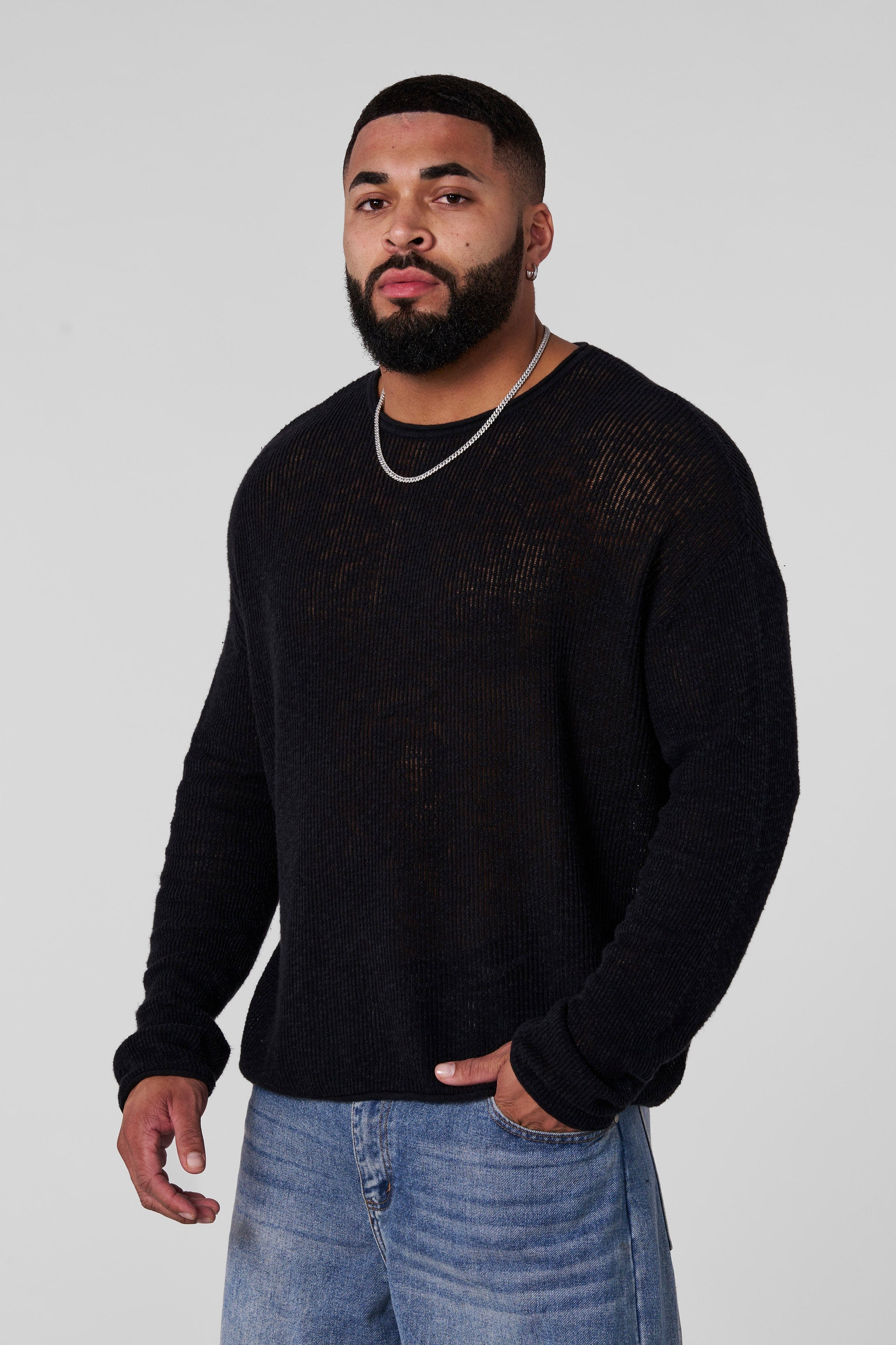 Back view of the white long sleeve crop top, demonstrating its elegant fit.