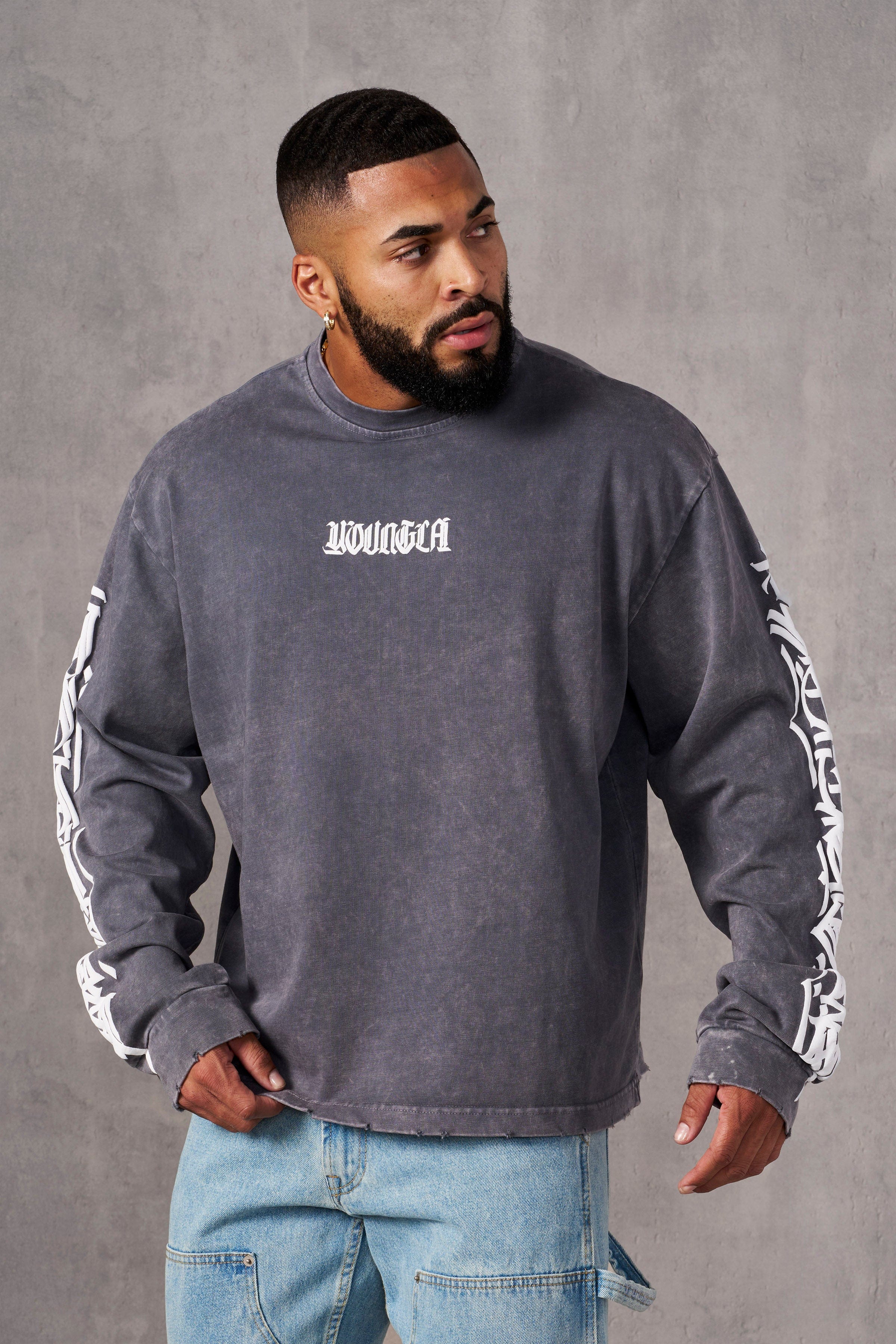 Side view of Aura Vintage Long Sleeve T-Shirt highlighting the acid wash finish.