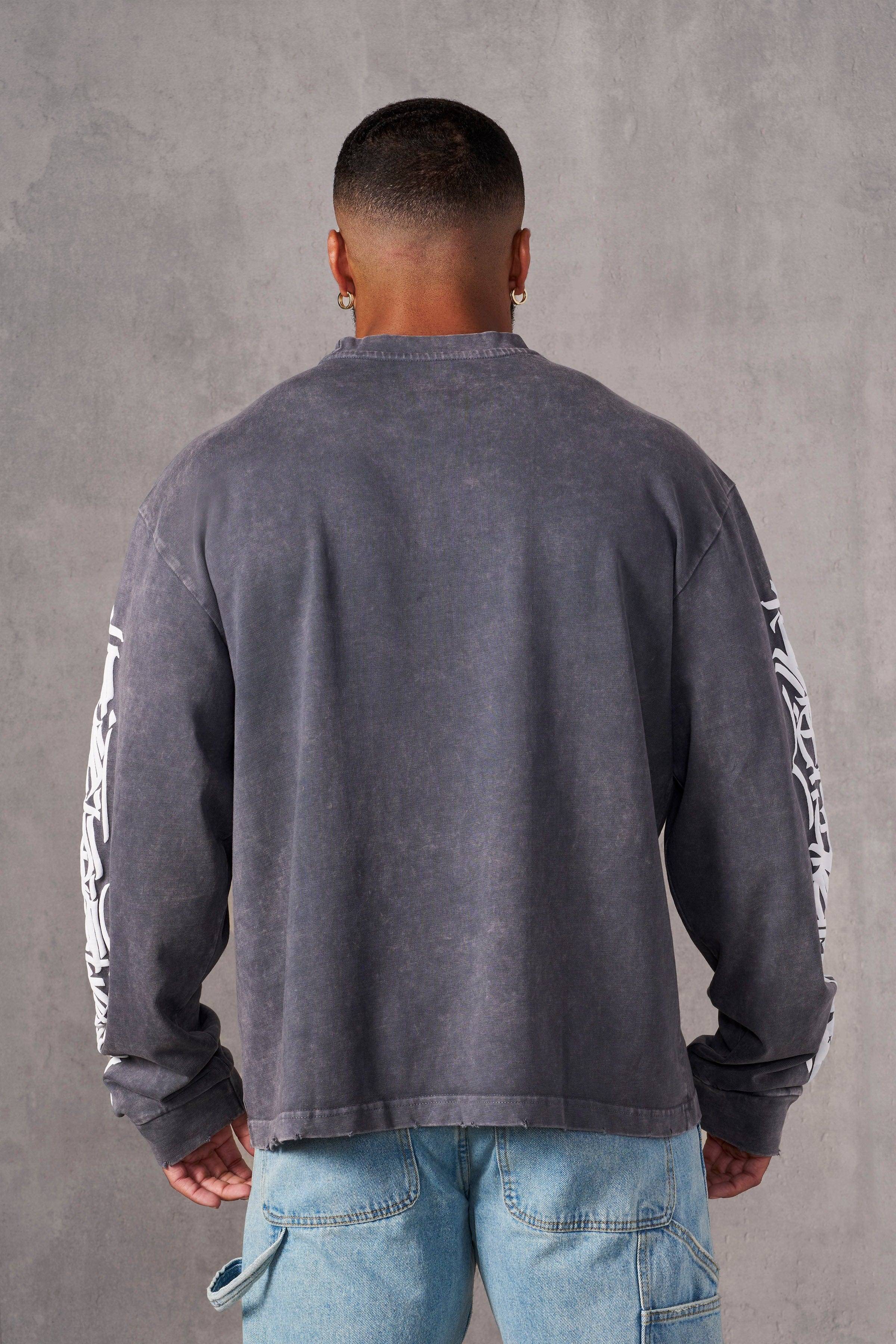 Model wearing Aura Vintage Long Sleeve T-Shirt in a casual setting.