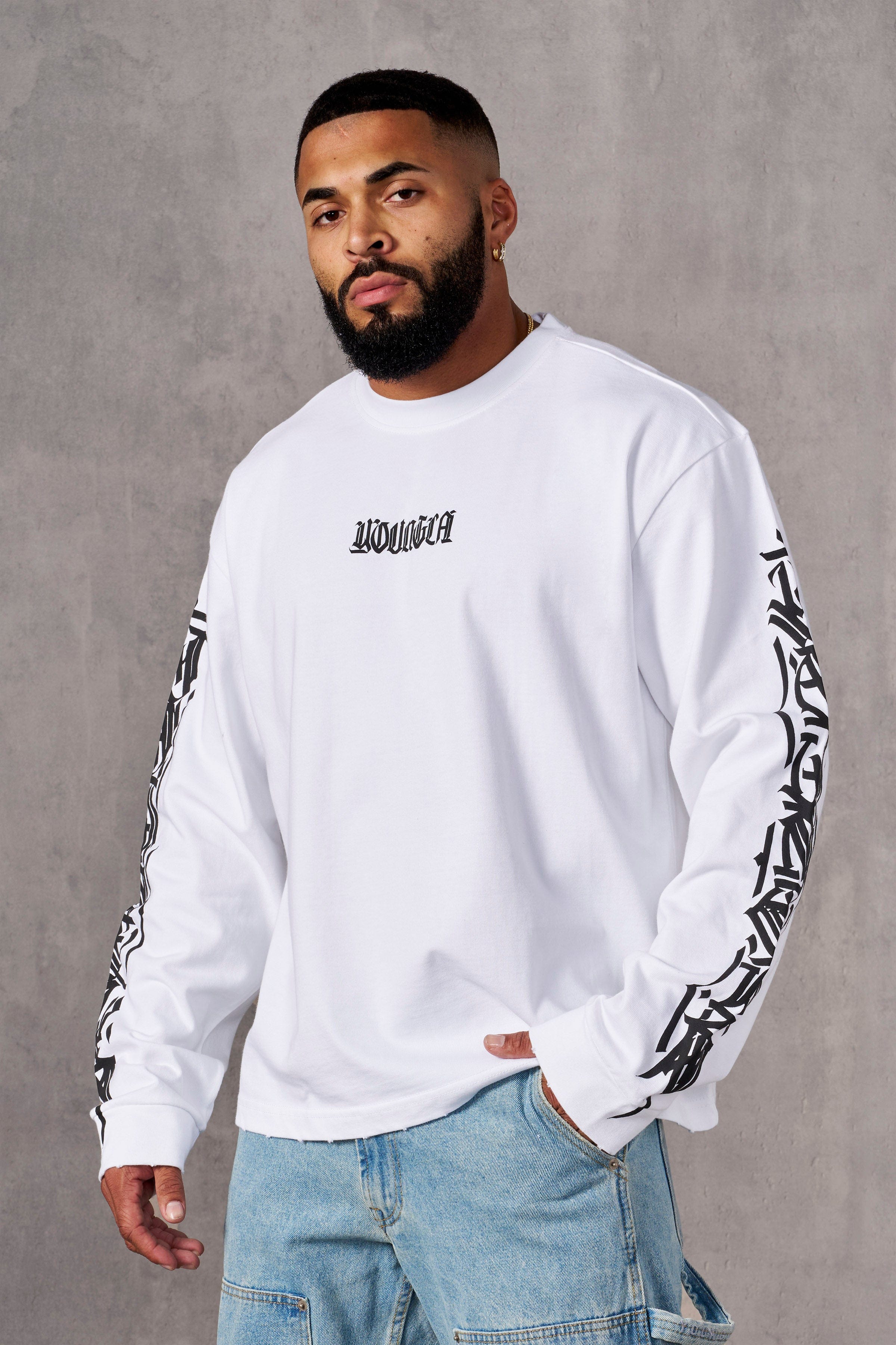 Side view of Aura Vintage Long Sleeve T-Shirt highlighting the acid wash finish.