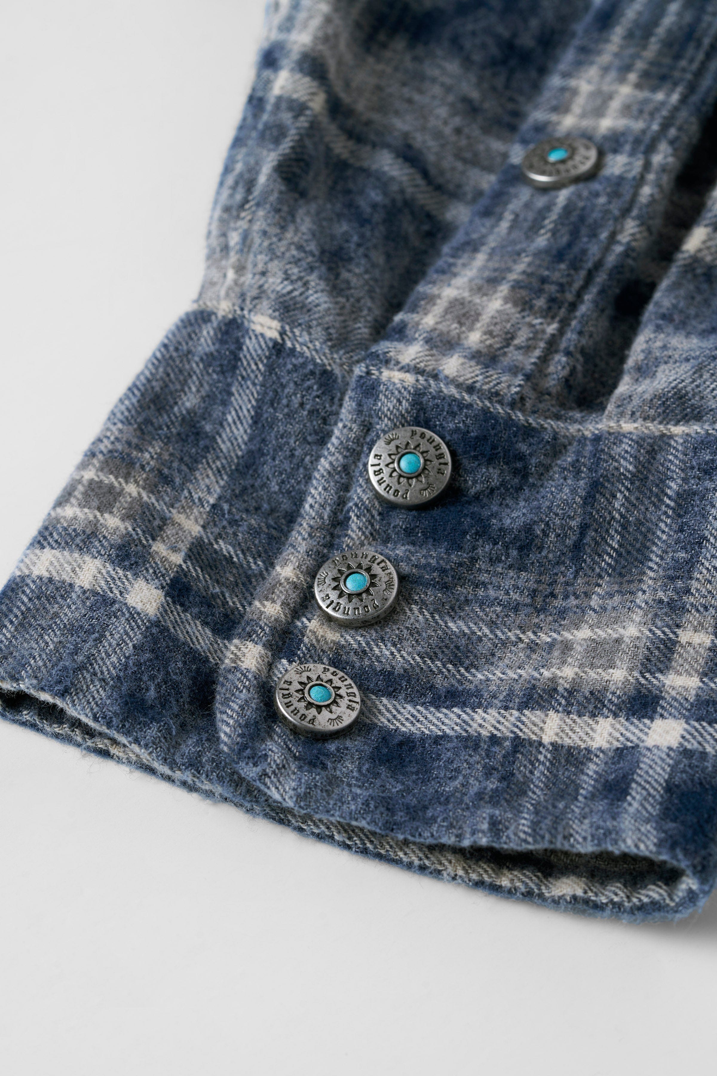 Close-up of Urban Outlaw mens flannel shirt showcasing the washed fabric texture.