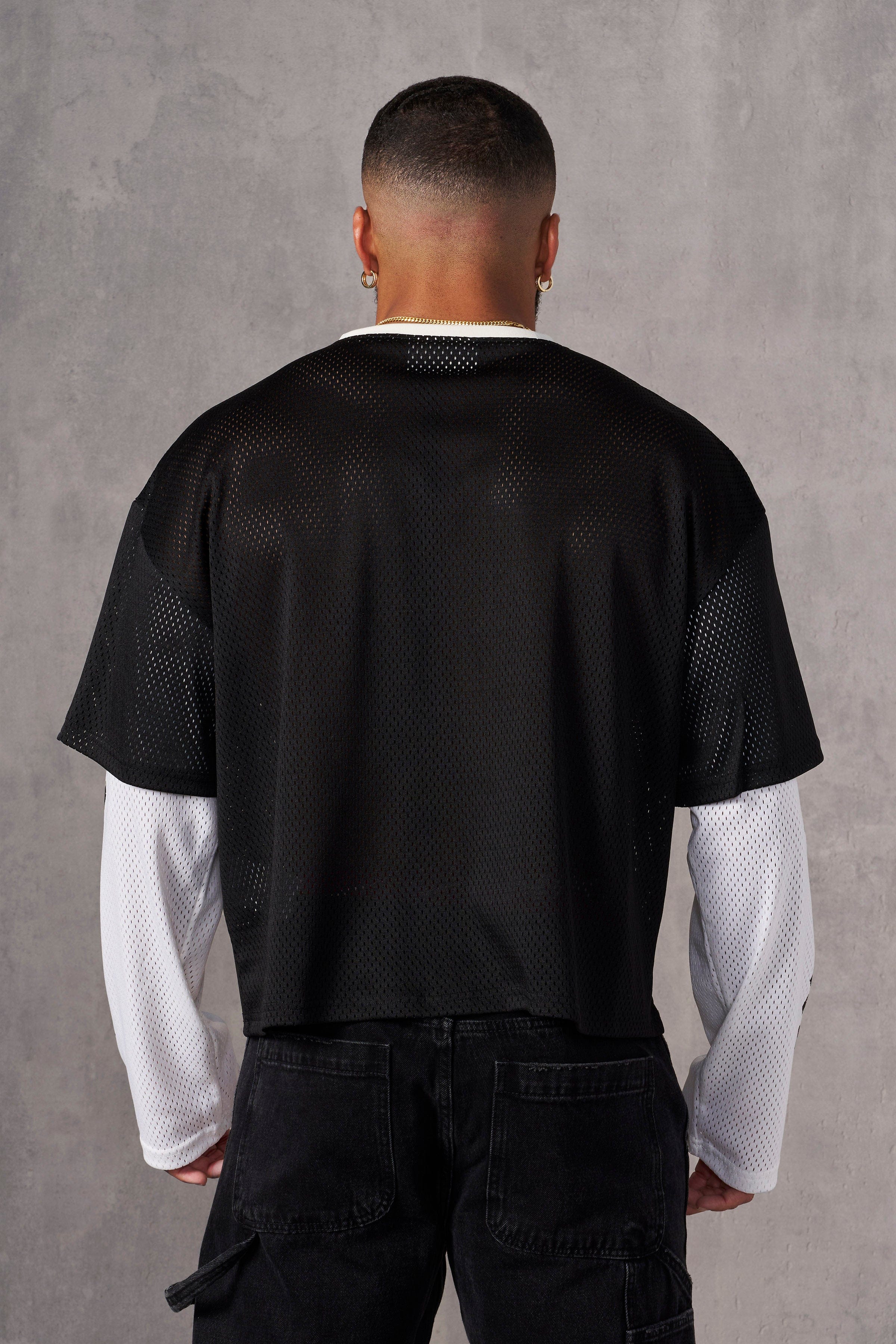 Side view of the long sleeve jersey highlighting the breathable fabric and relaxed fit.