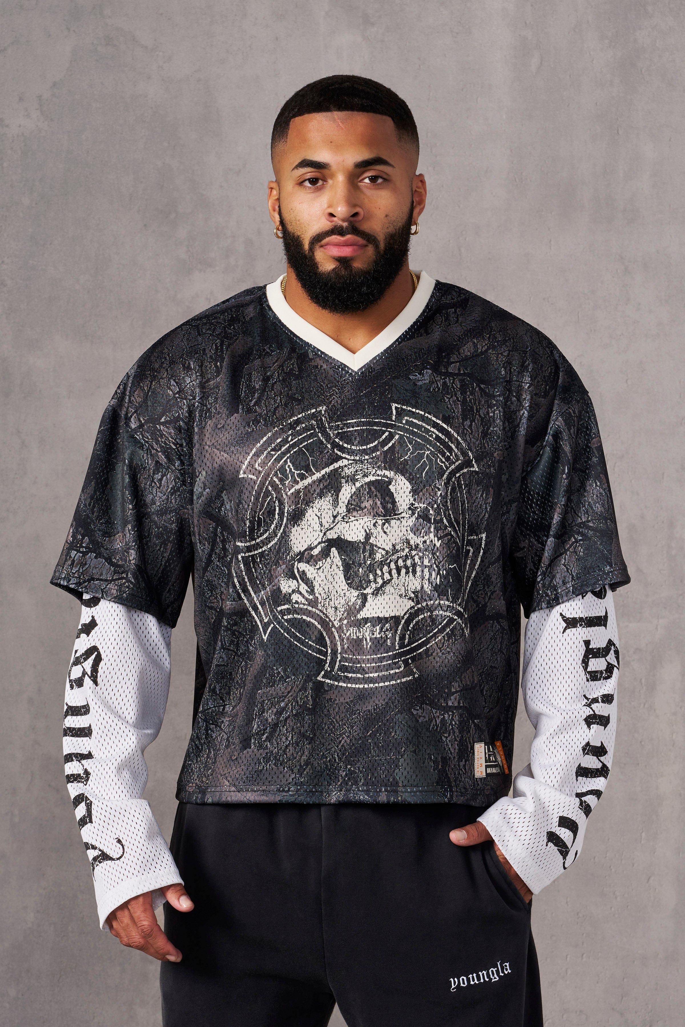 Side view of the long sleeve jersey highlighting the breathable fabric and relaxed fit.