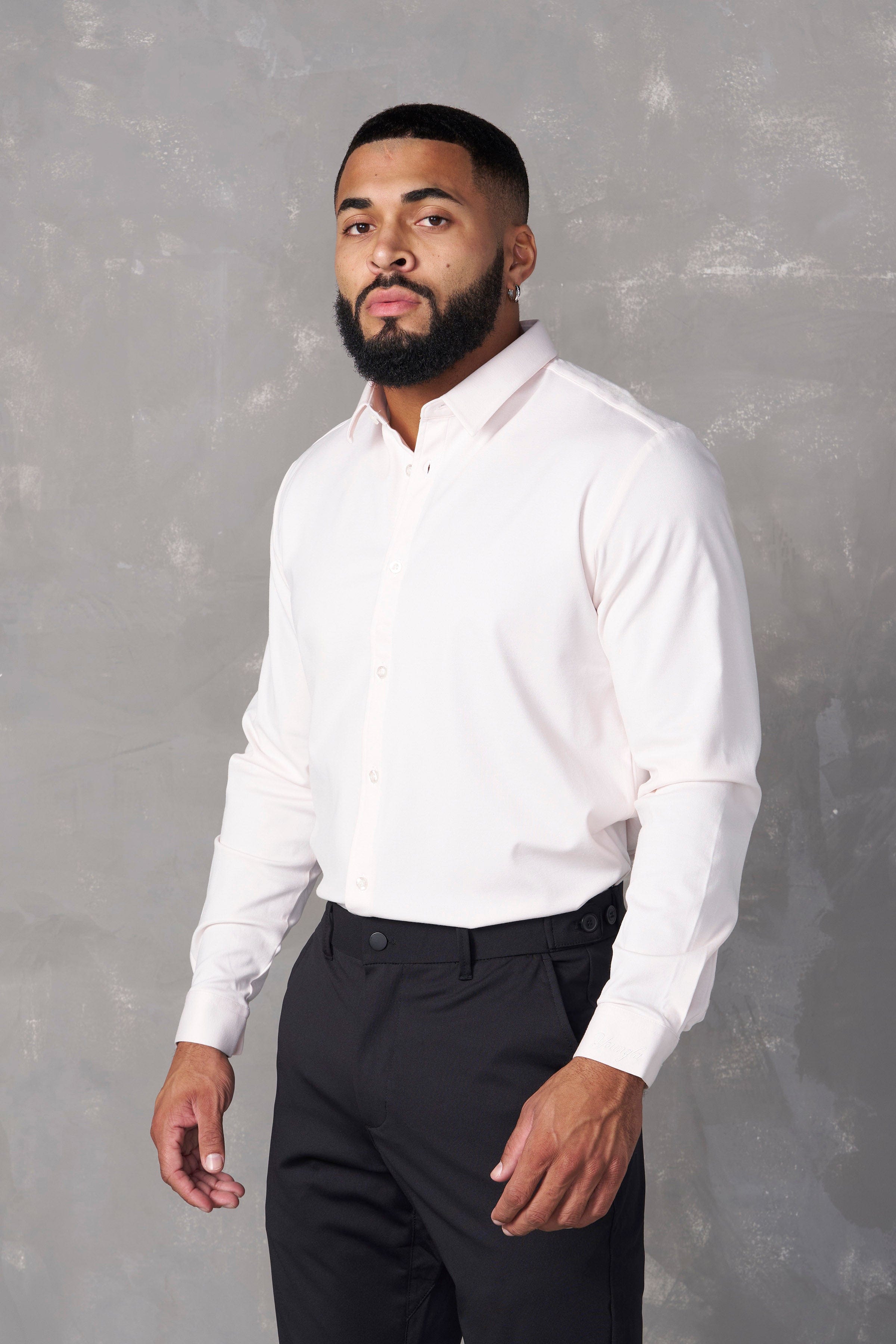 Close-up of a tailored dress shirt showcasing its fabric and fit.