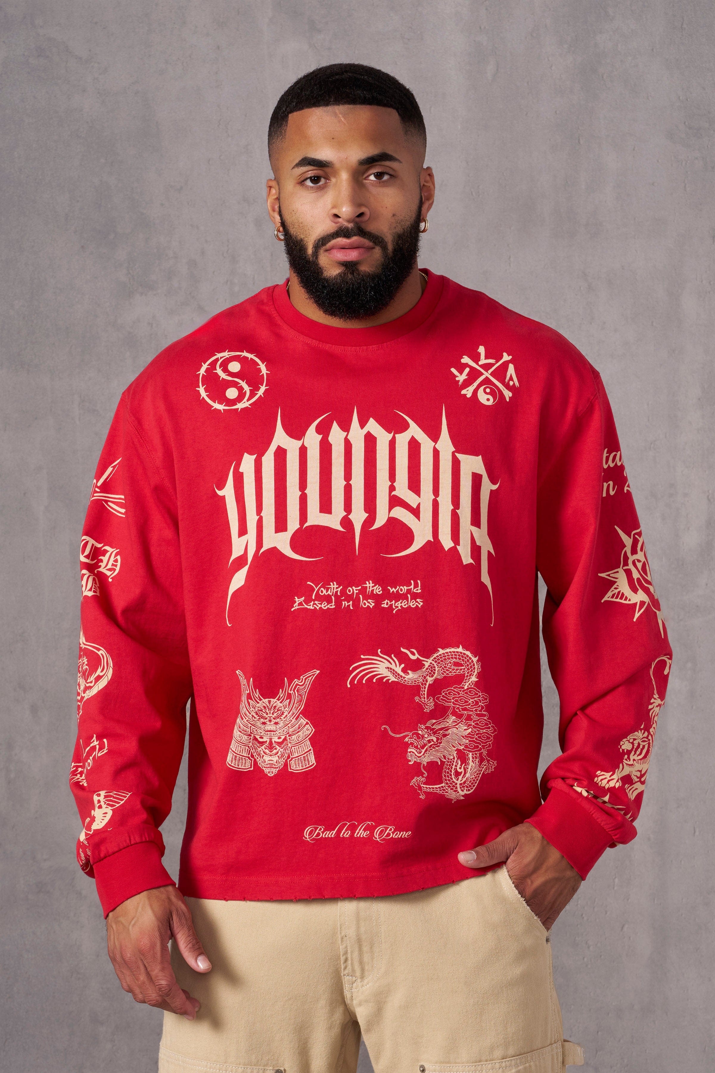 Front view of BMF long sleeves worn by model on rooftop at sunset