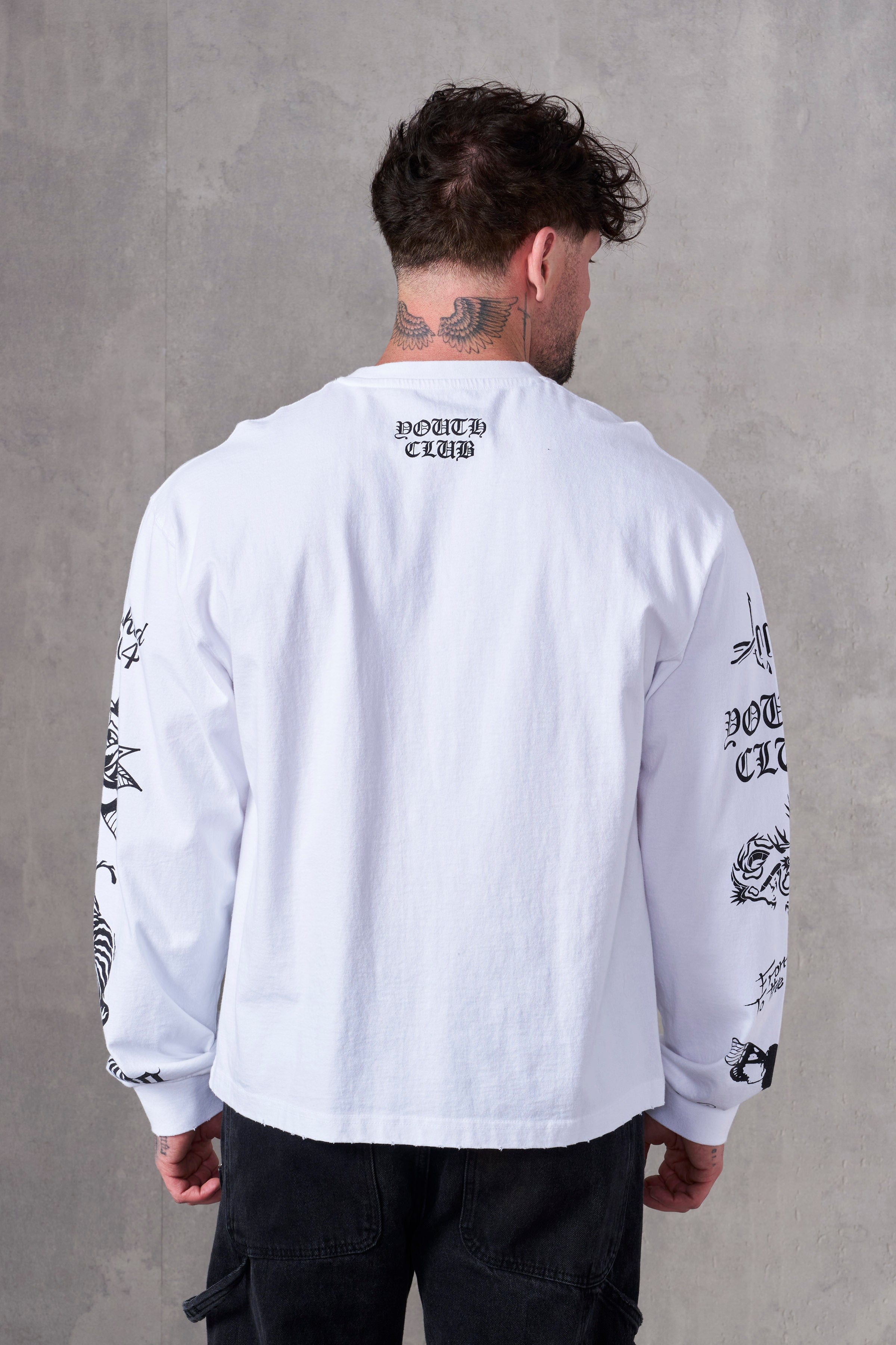 Front view of BMF long sleeves worn by model on rooftop at sunset