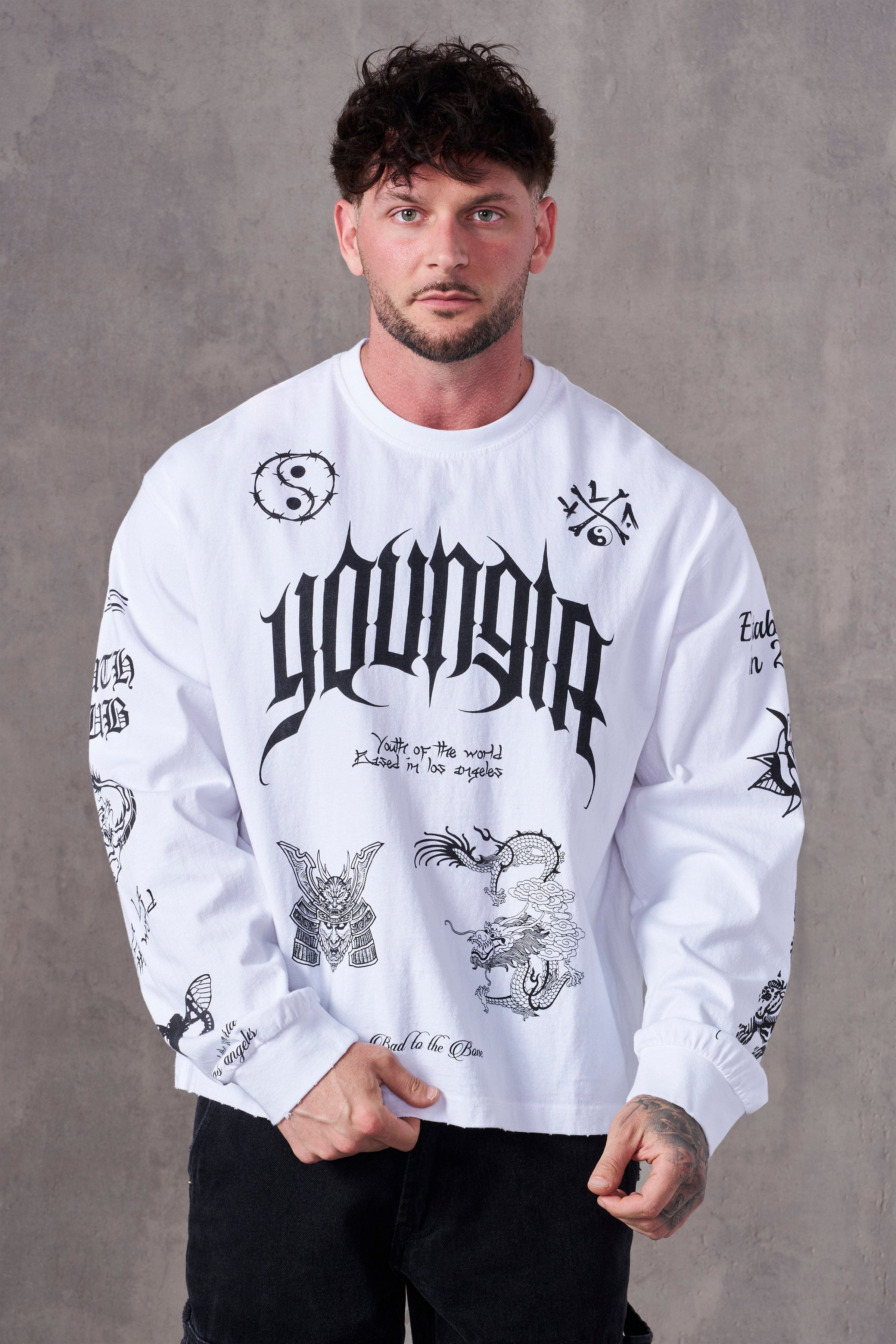 Front view of BMF long sleeves worn by model on rooftop at sunset