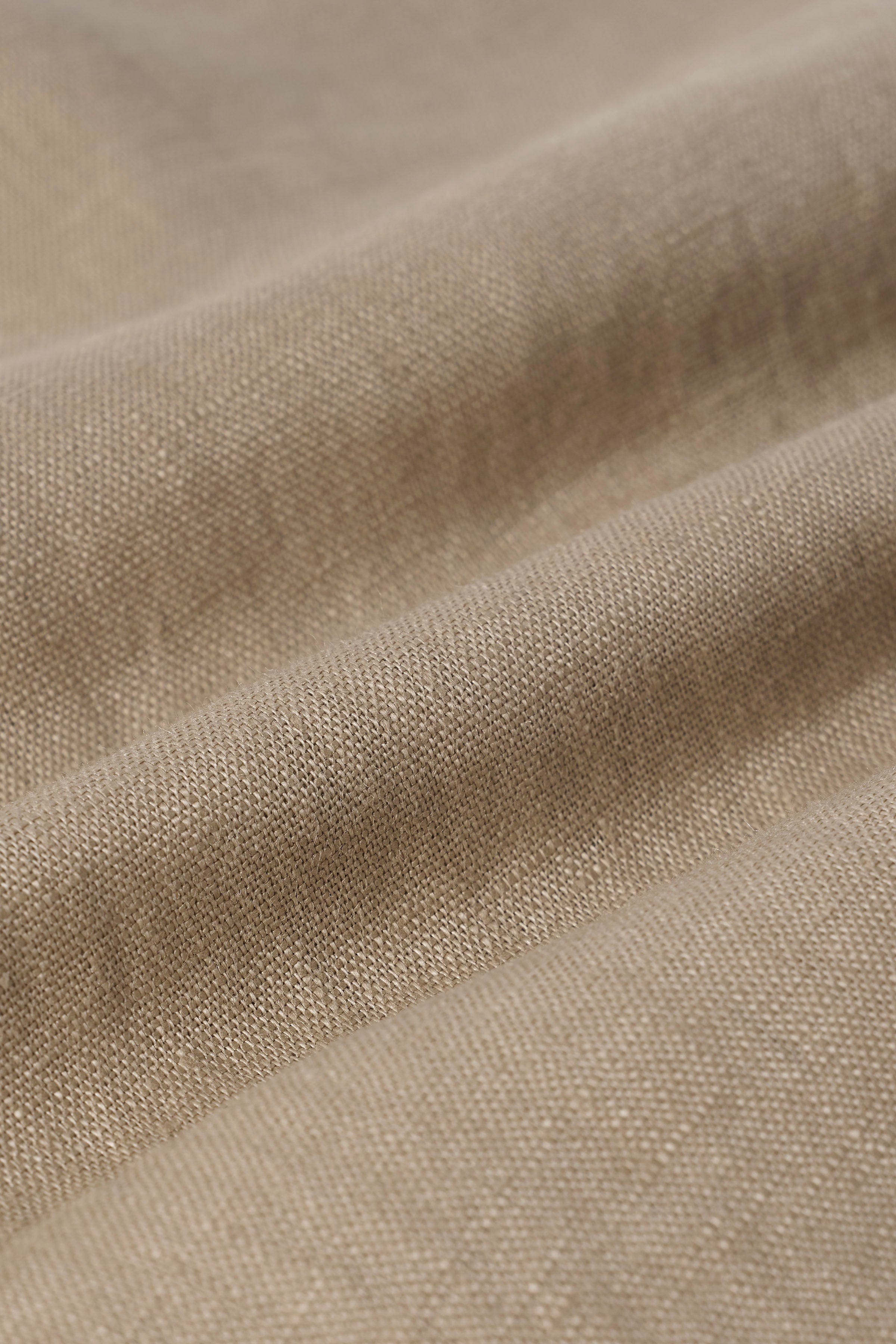 Close-up of linen button down shirt showing textured fabric detail