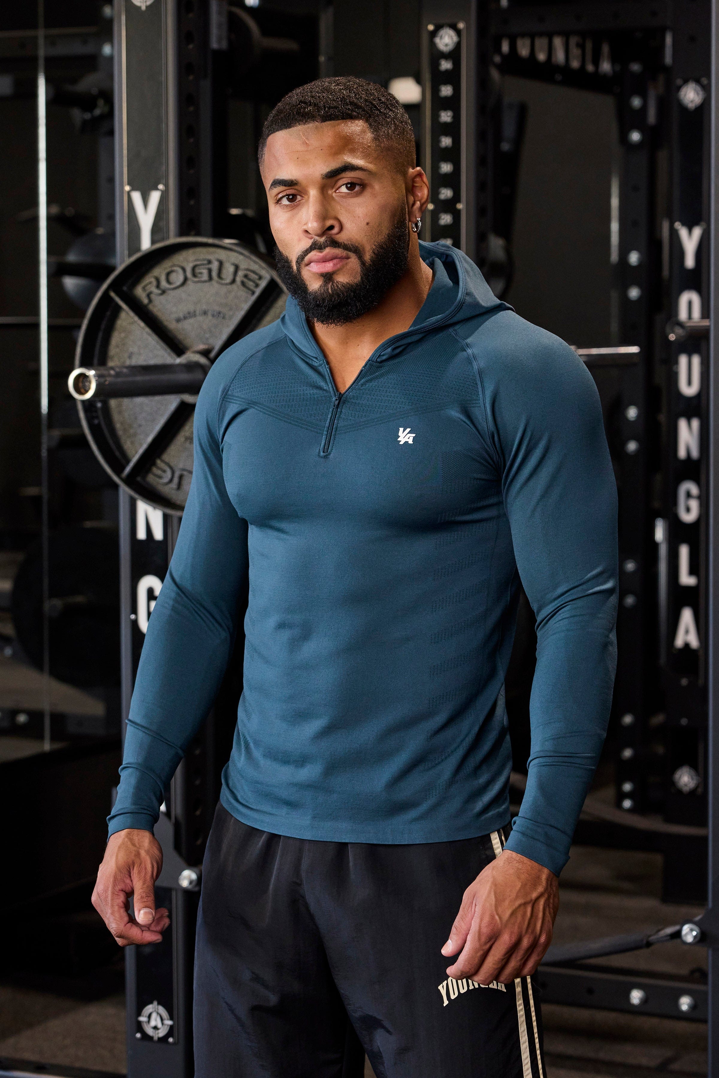 Back profile of no sleeve hoodie workout style showing design contours and brand detailing.