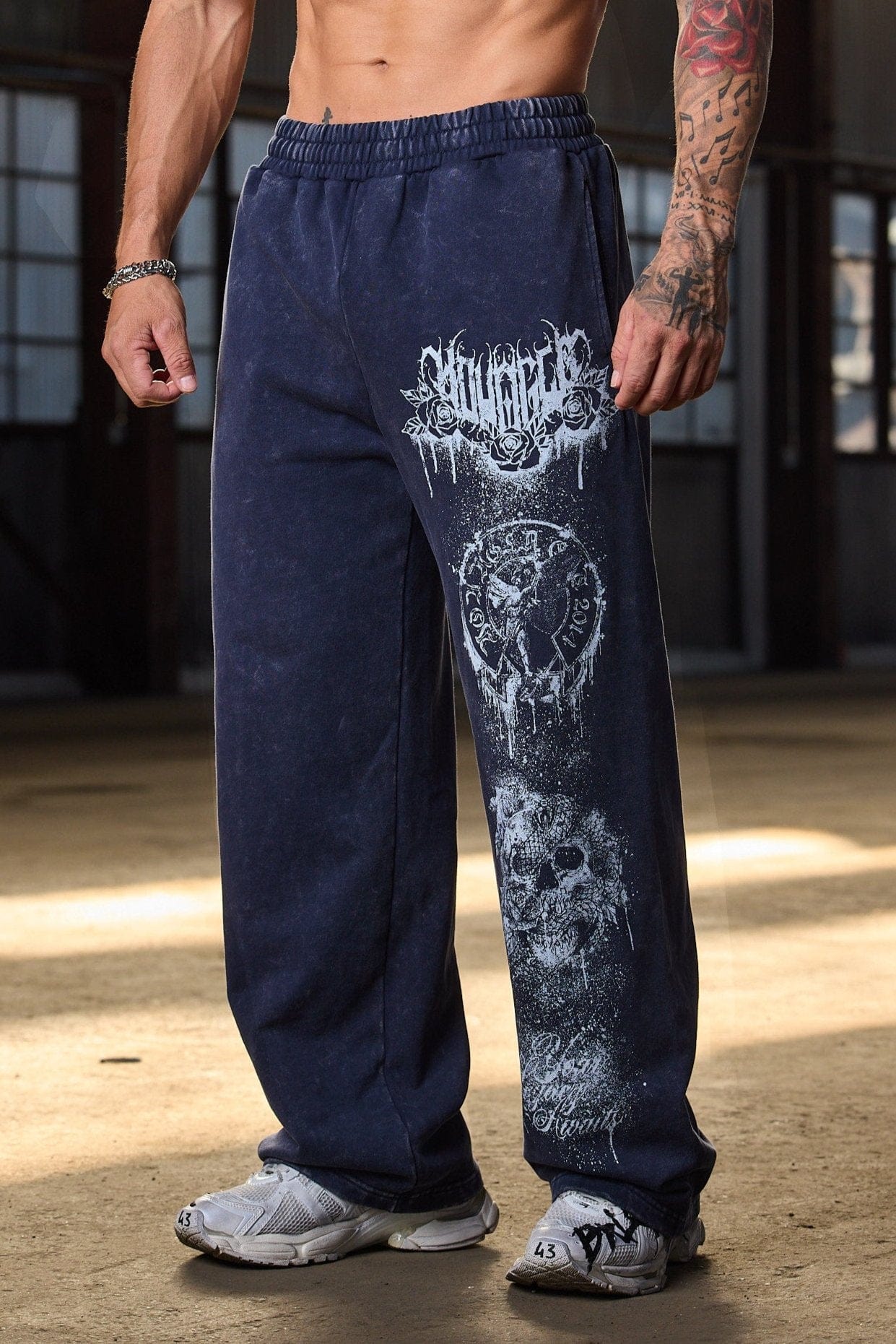 Front view of a model in Dynasty baggy joggers with splatter print.