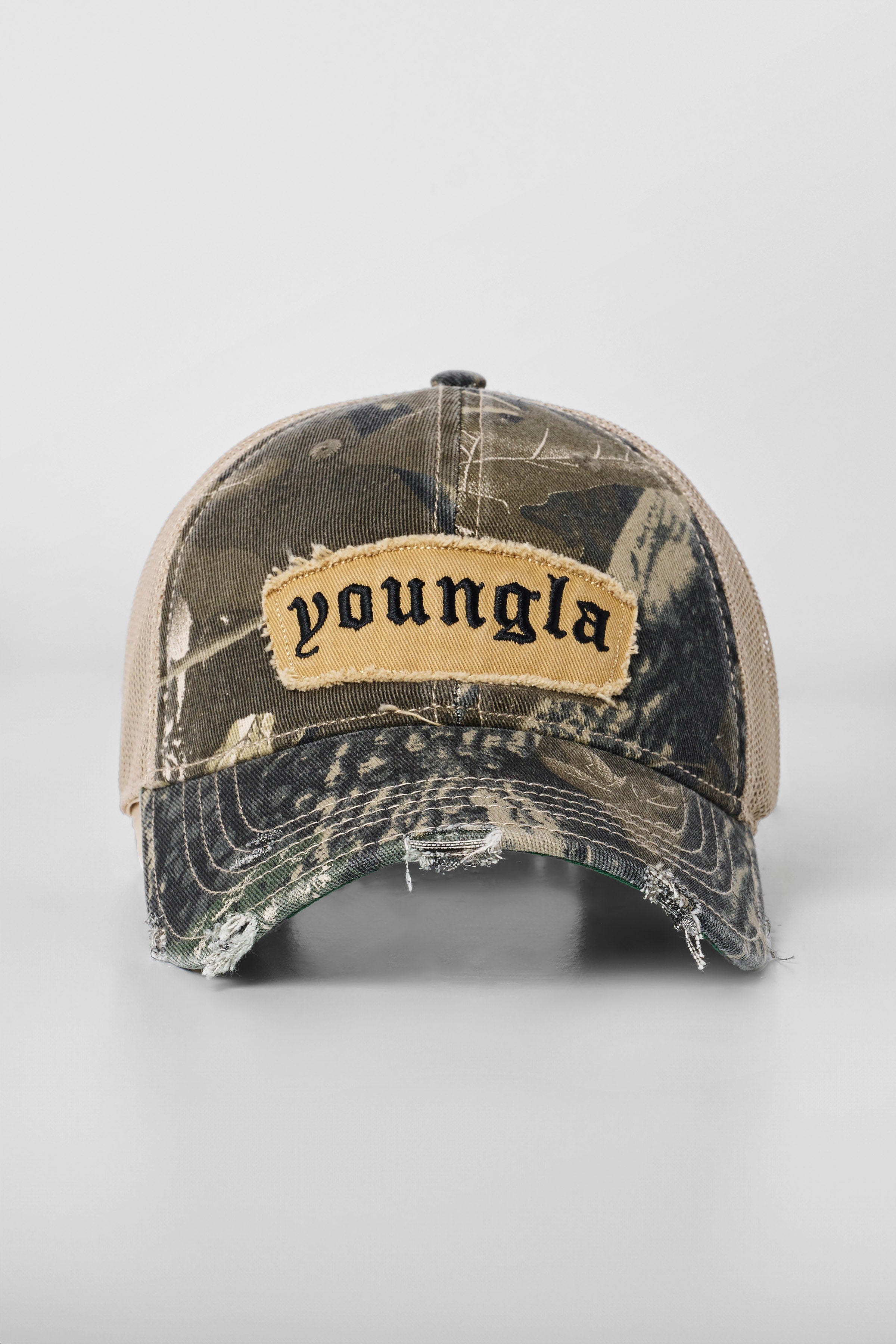 Side angle of the dad hat highlighting the frayed logo patch.