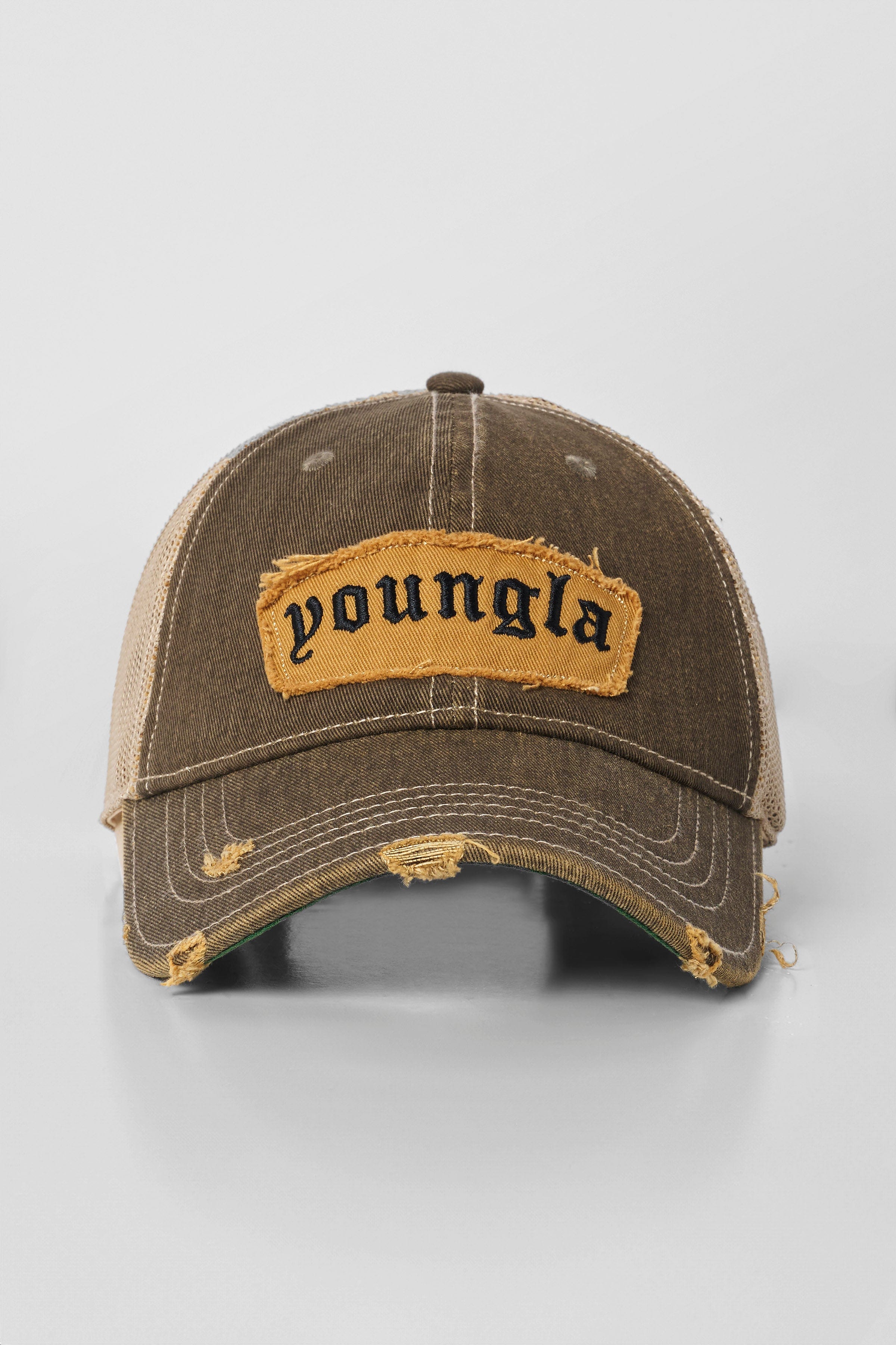 Side angle of the dad hat highlighting the frayed logo patch.