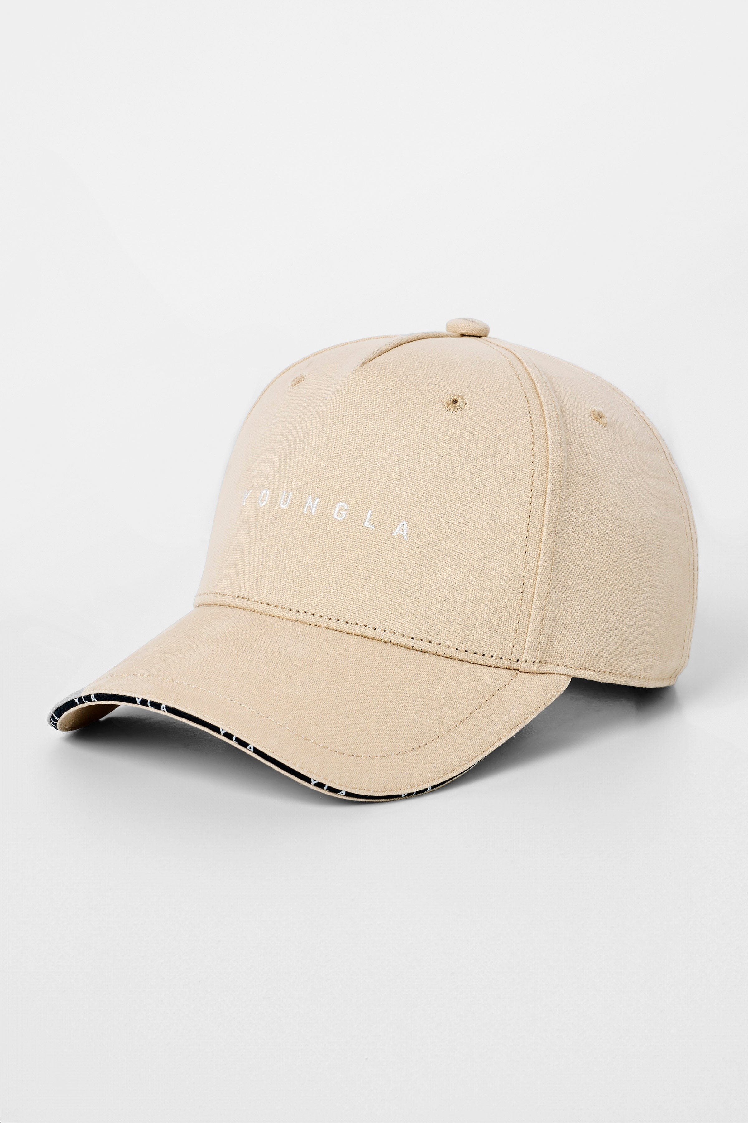 Close-up of embroidered logo on cotton hat with piping accents