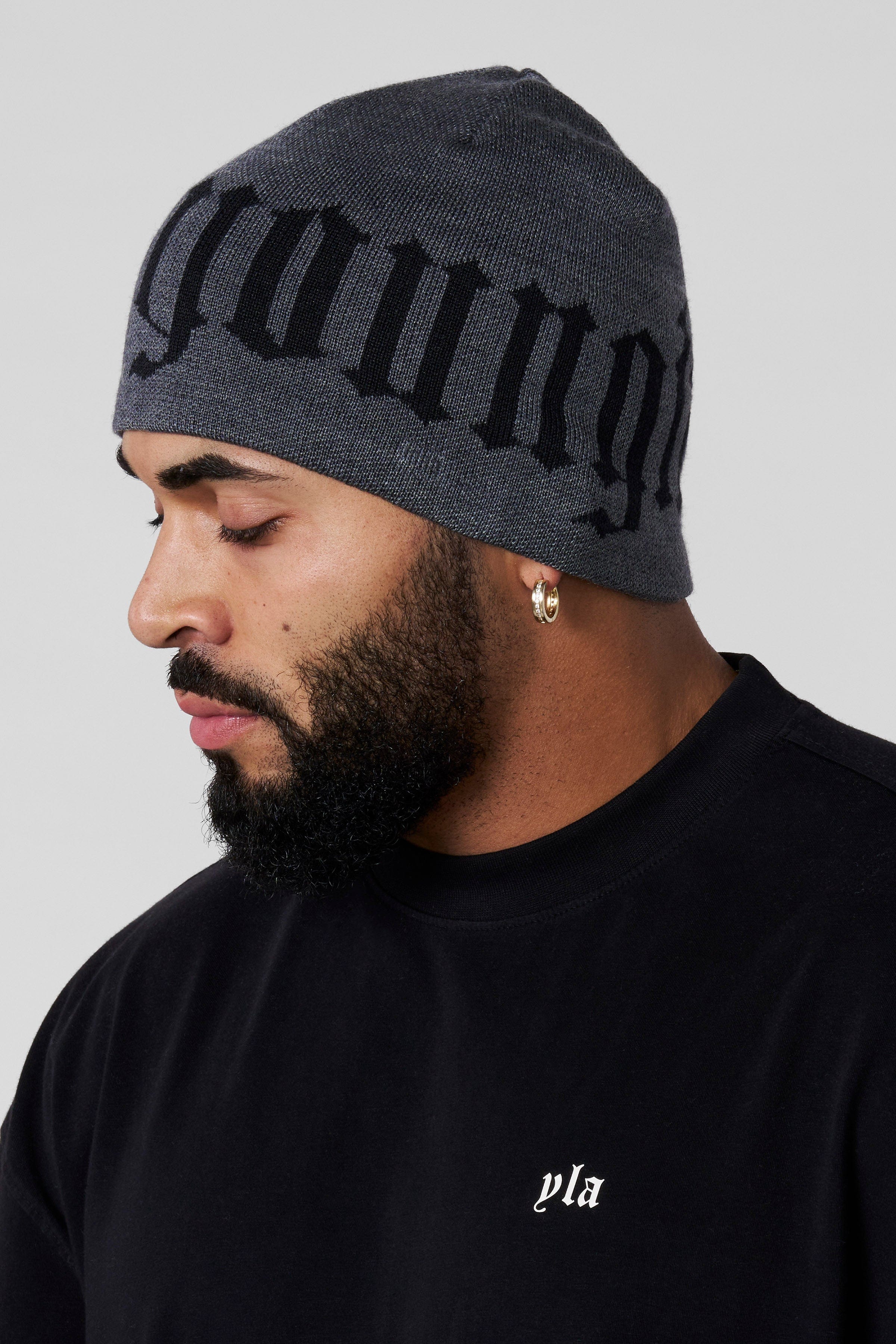Close-up of the urban skull beanie featuring bold logo design.