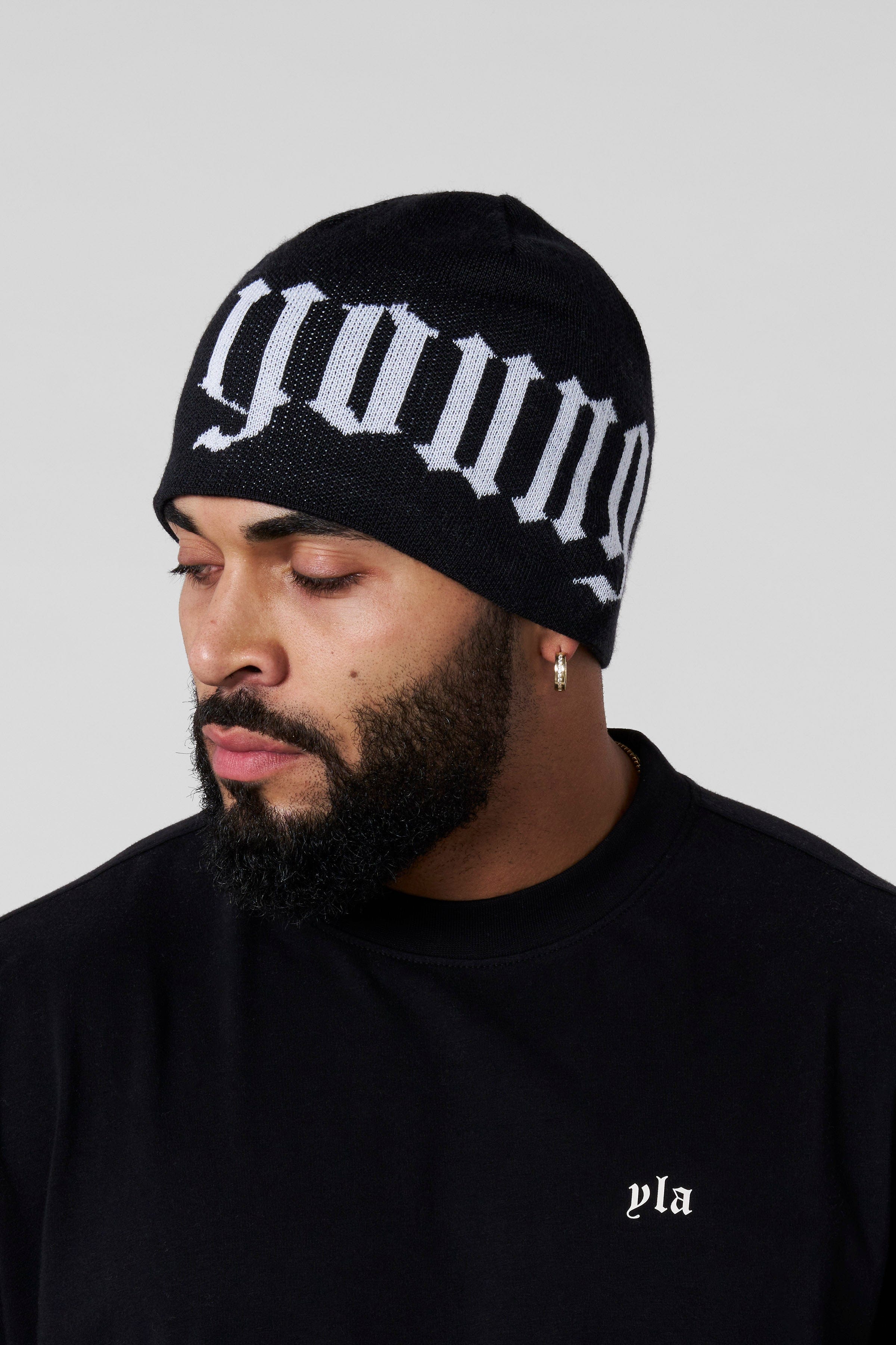 Urban skull beanie worn in a winter urban setting, perfect for men.