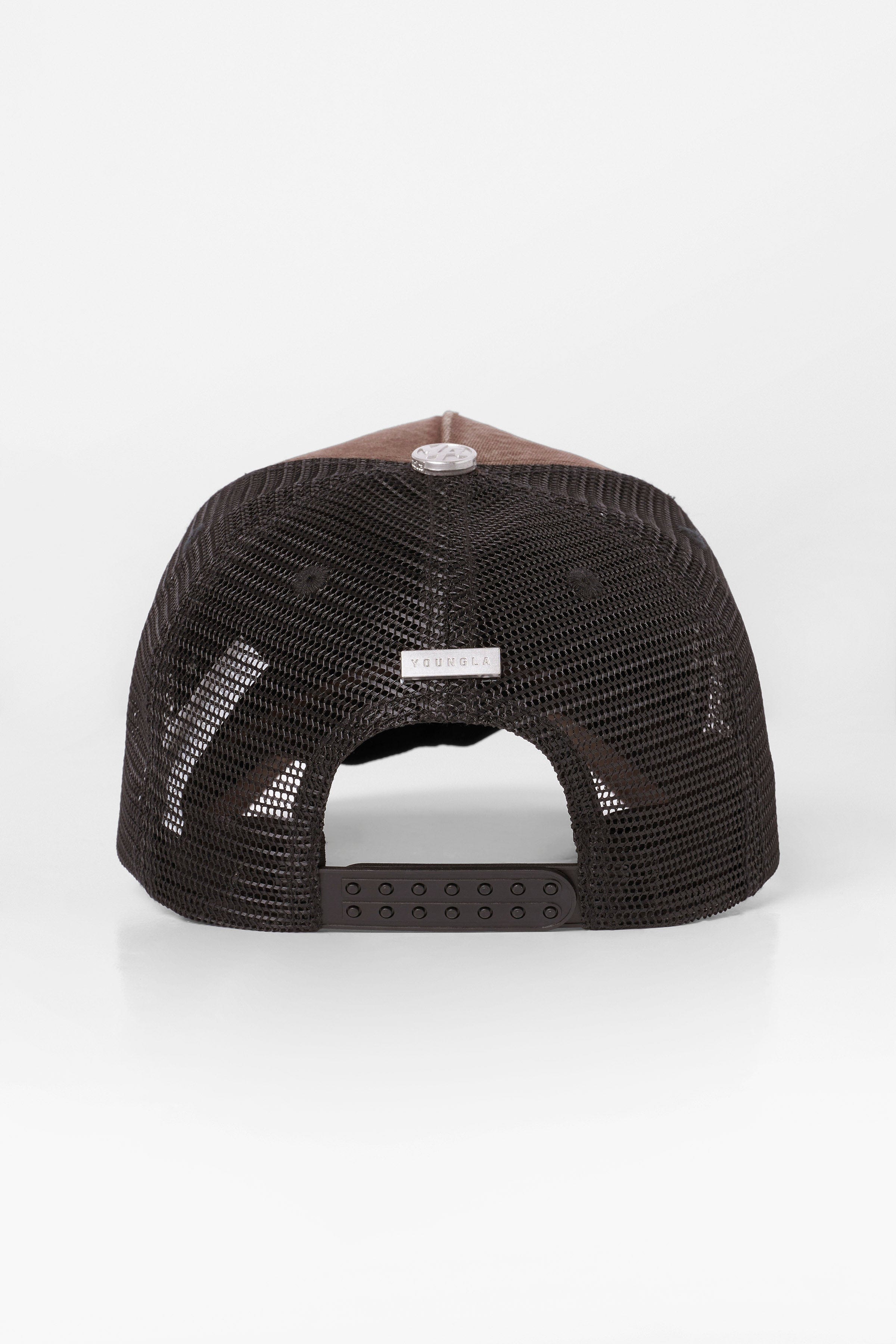 Western Dream Trucker Hat showcased against a rustic background, perfect for rodeo events.