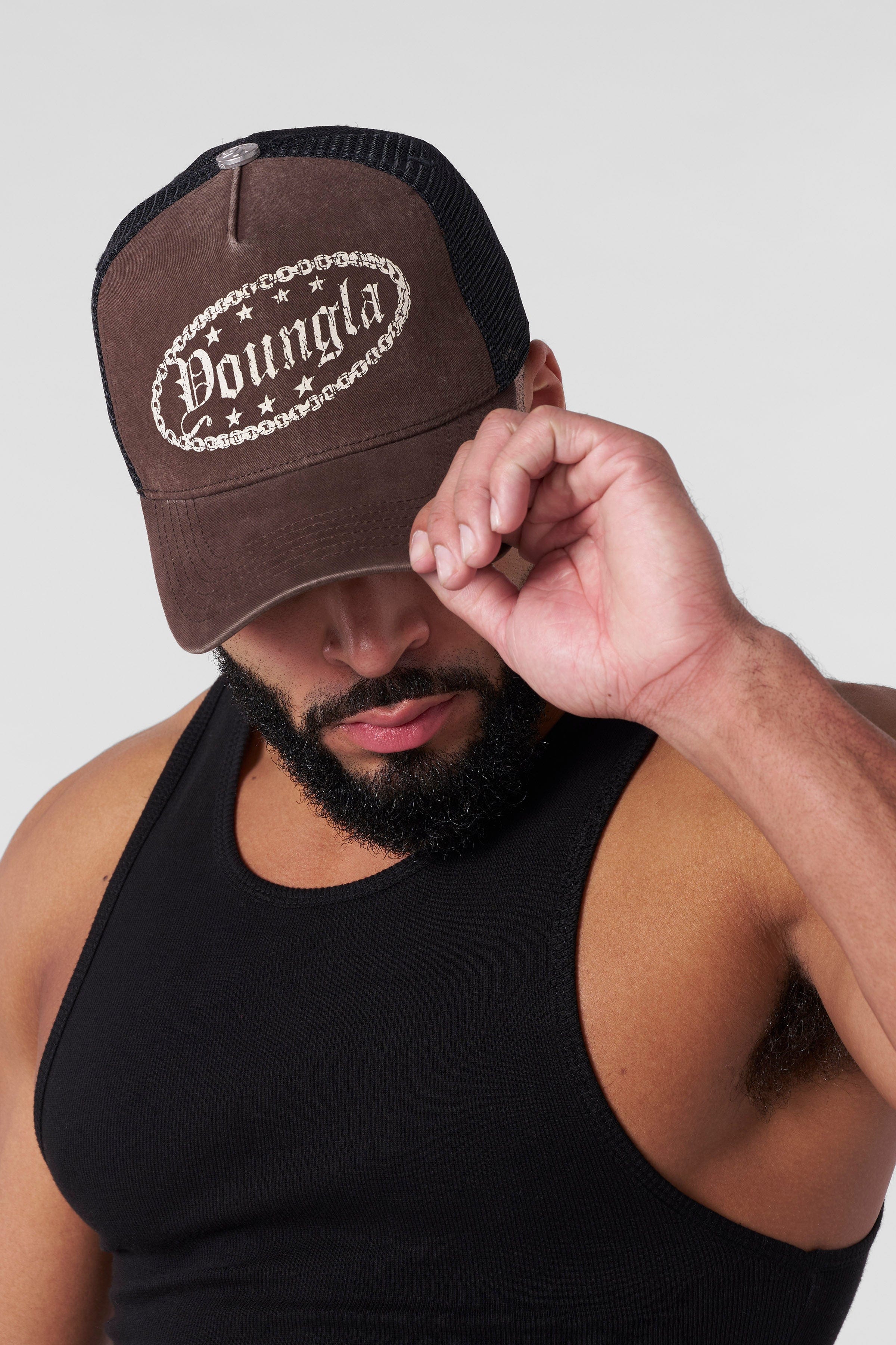 Western Dream Trucker Hat showcased against a rustic background, perfect for rodeo events.