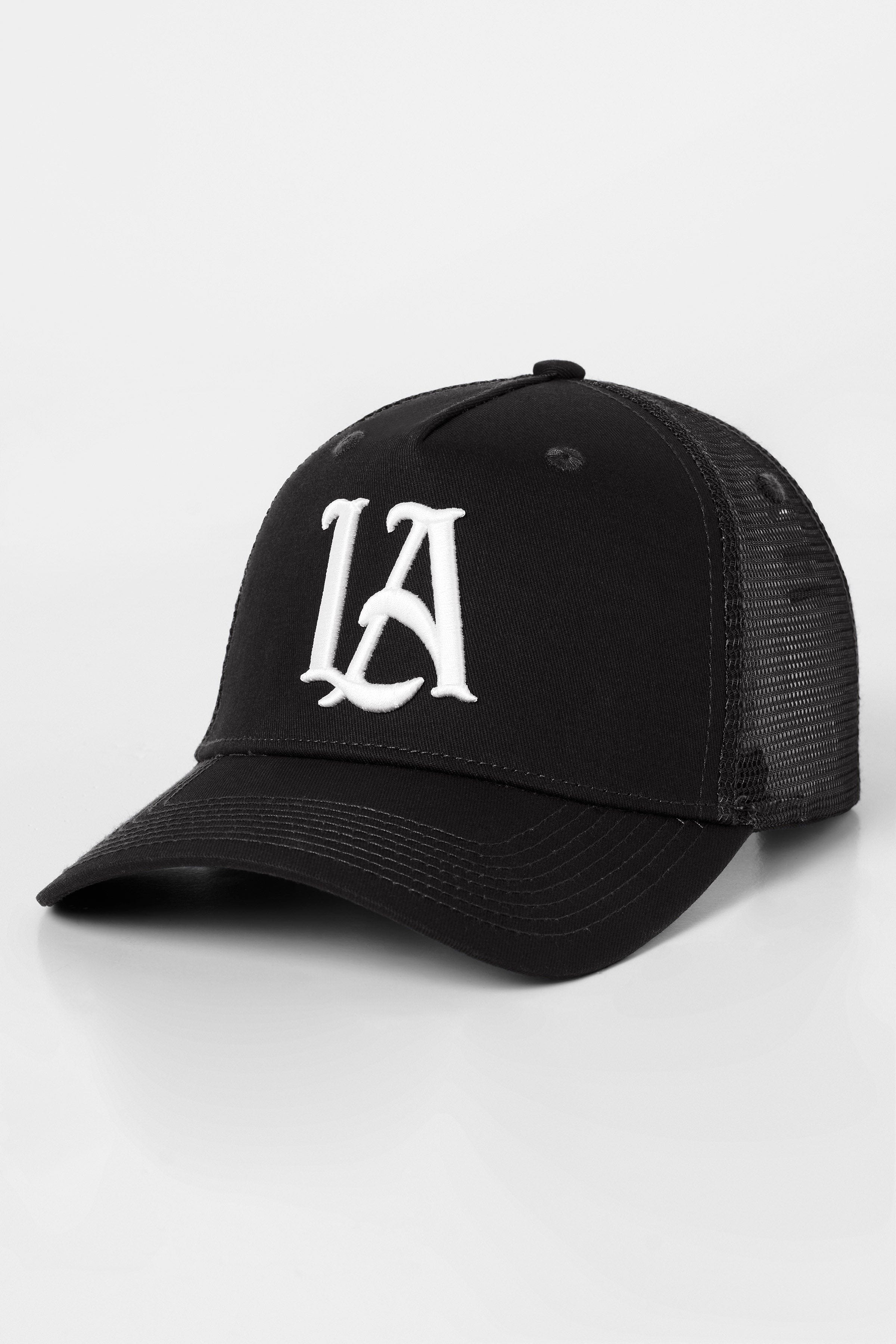 Front view of LA embroidered trucker hat in A-frame style worn in downtown LA