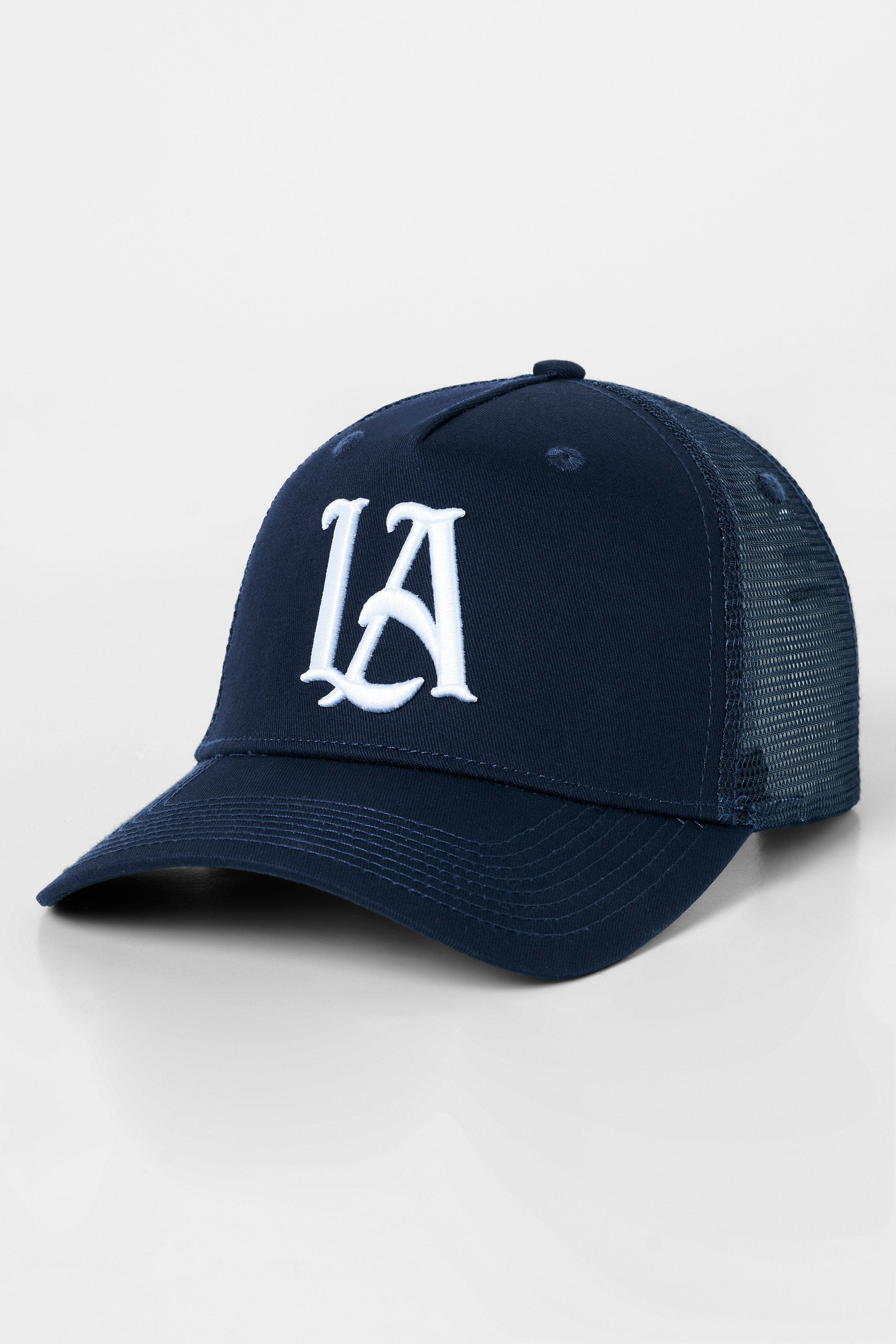 Front view of LA embroidered trucker hat in A-frame style worn in downtown LA