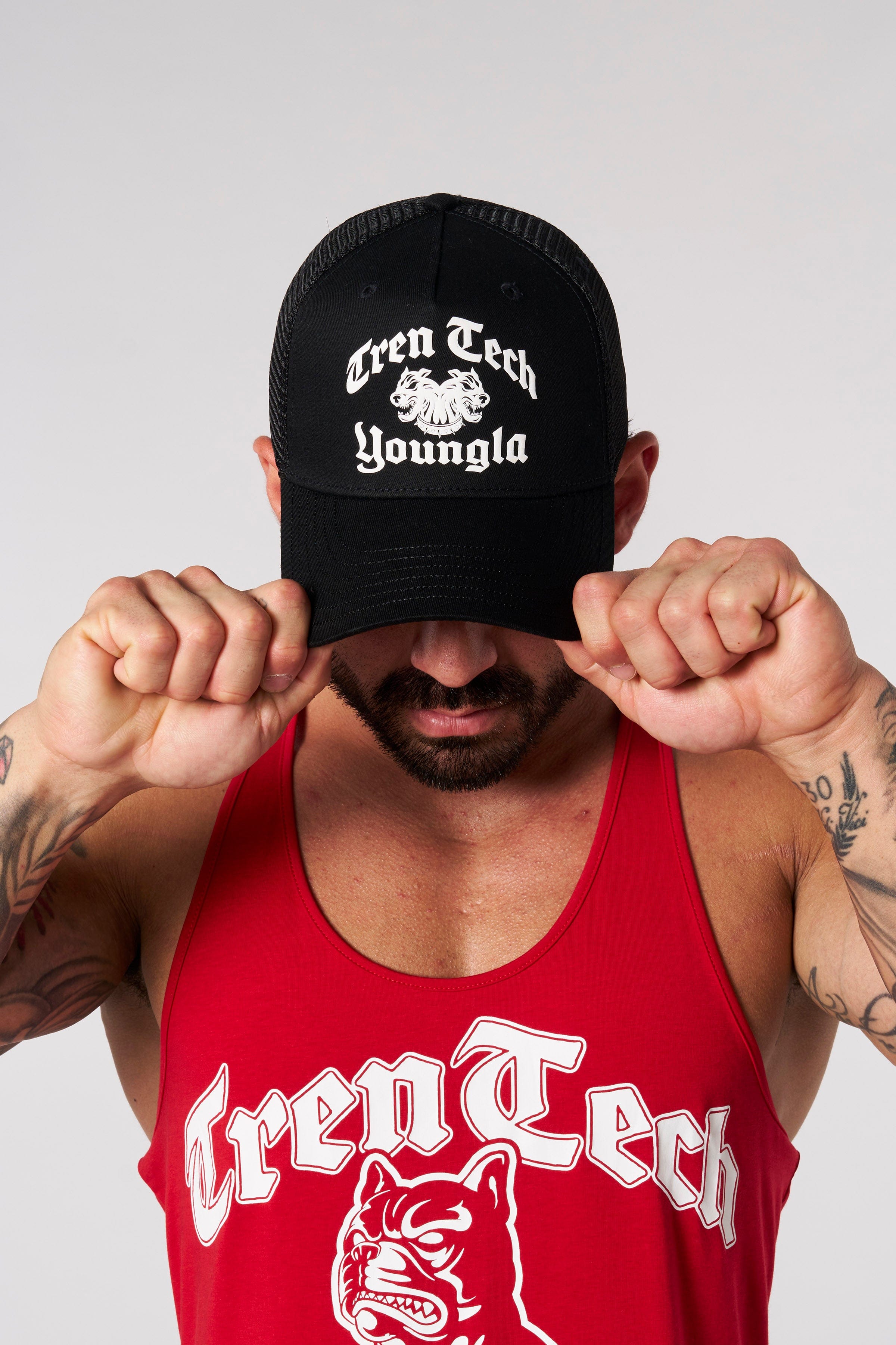 Front view of a trendy custom trucker hat with bold logos