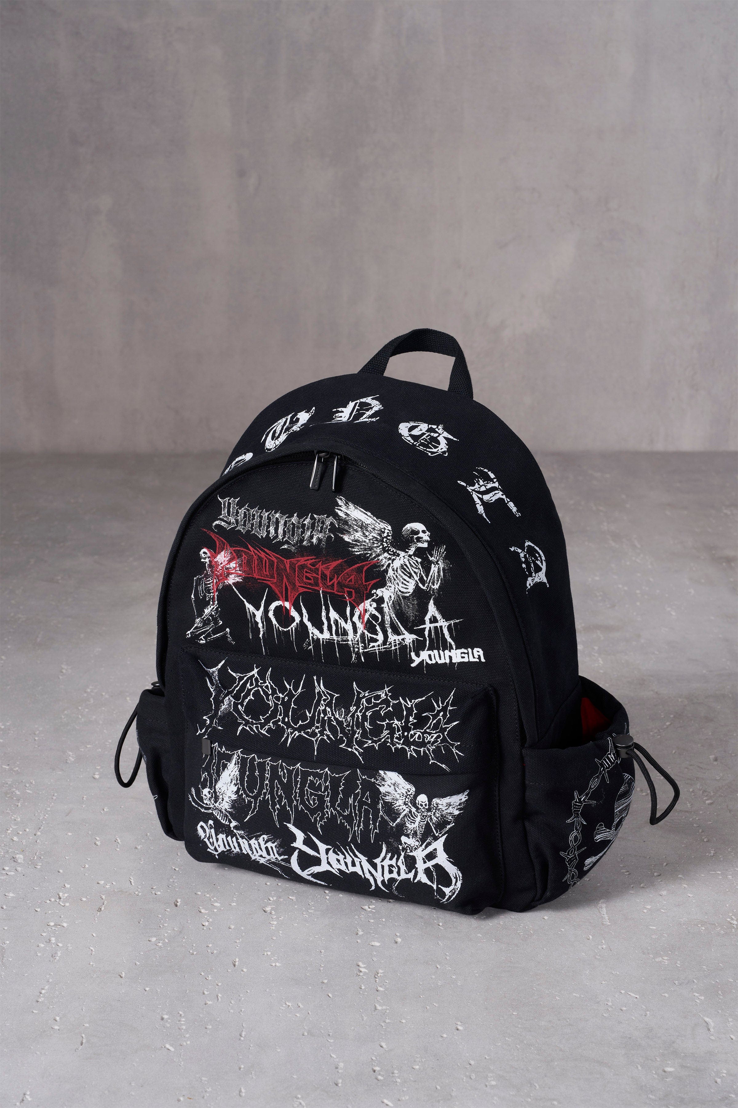 Side view showing adjustable pockets of canvas backpack