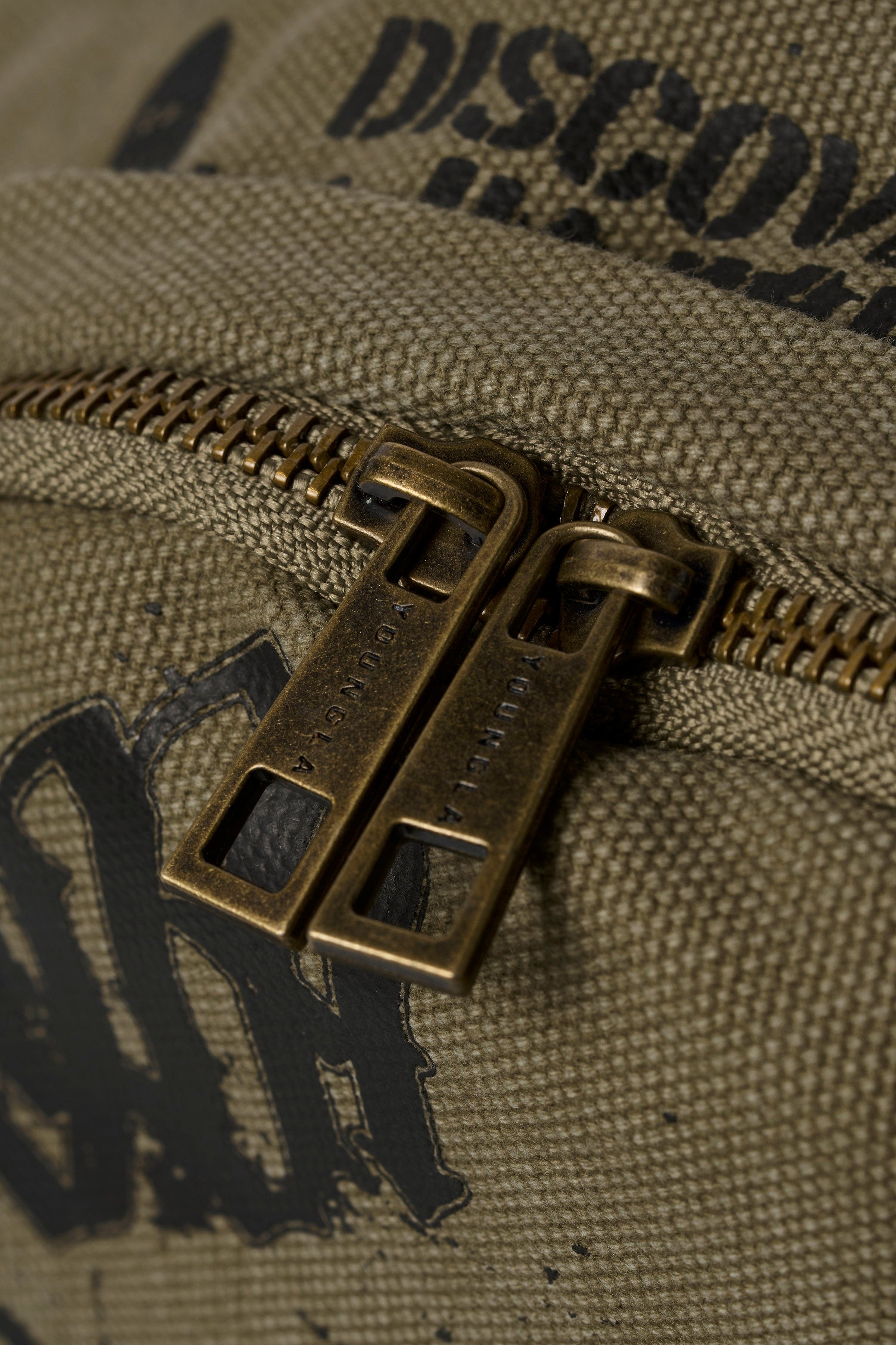 Front view of the rugged canvas tactical backpack with military-inspired design.