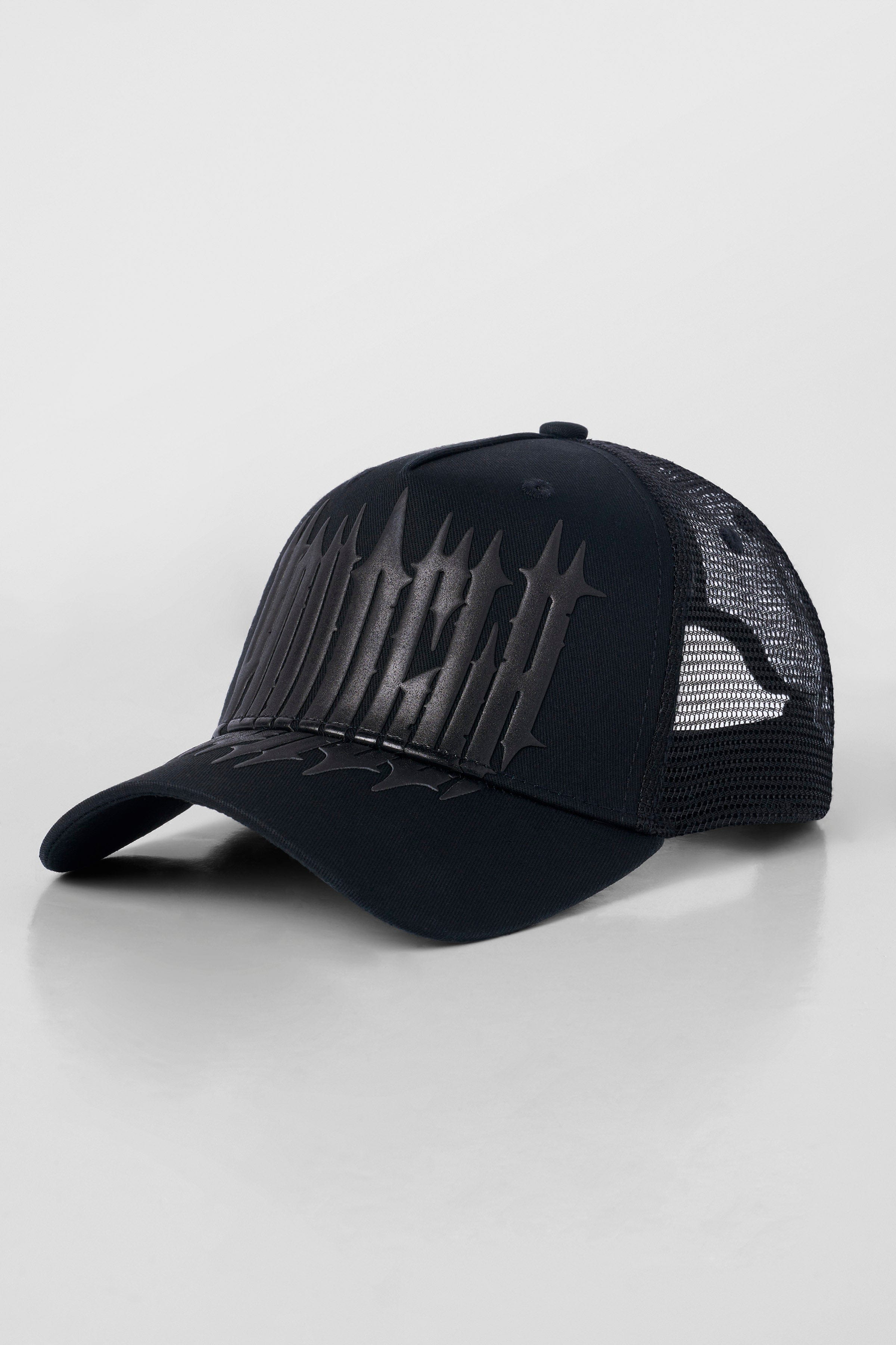 Custom trucker hats photographed at golden hour near Austin street mural