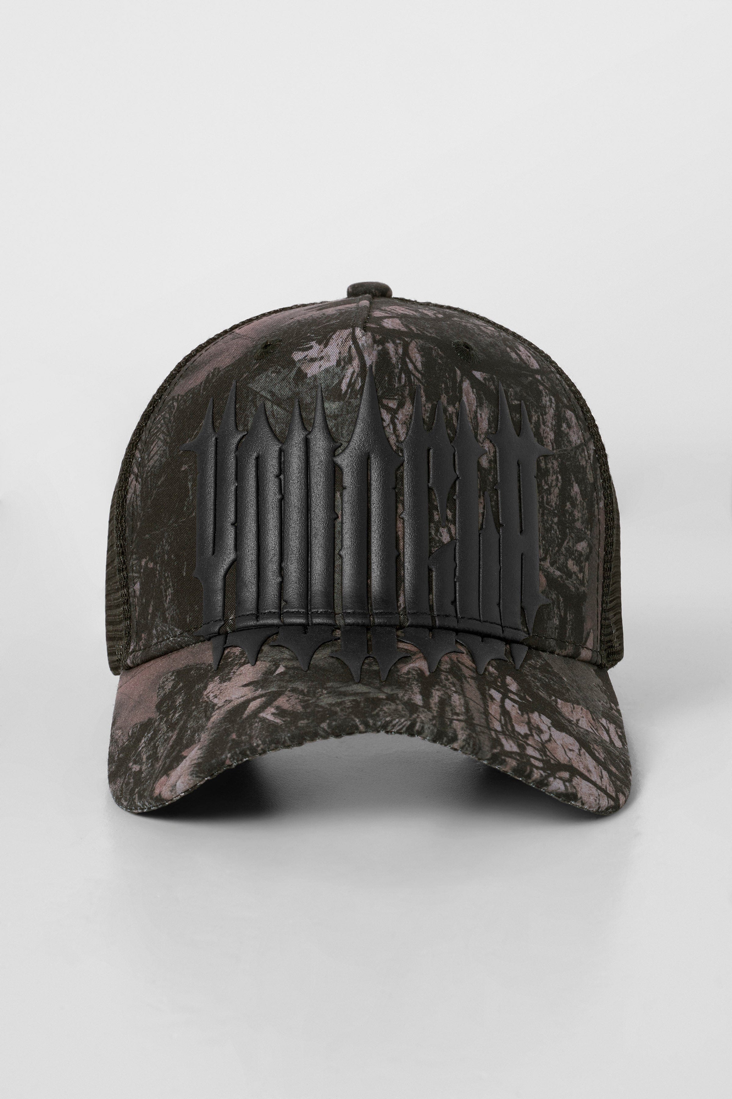 Custom trucker hats photographed at golden hour near Austin street mural