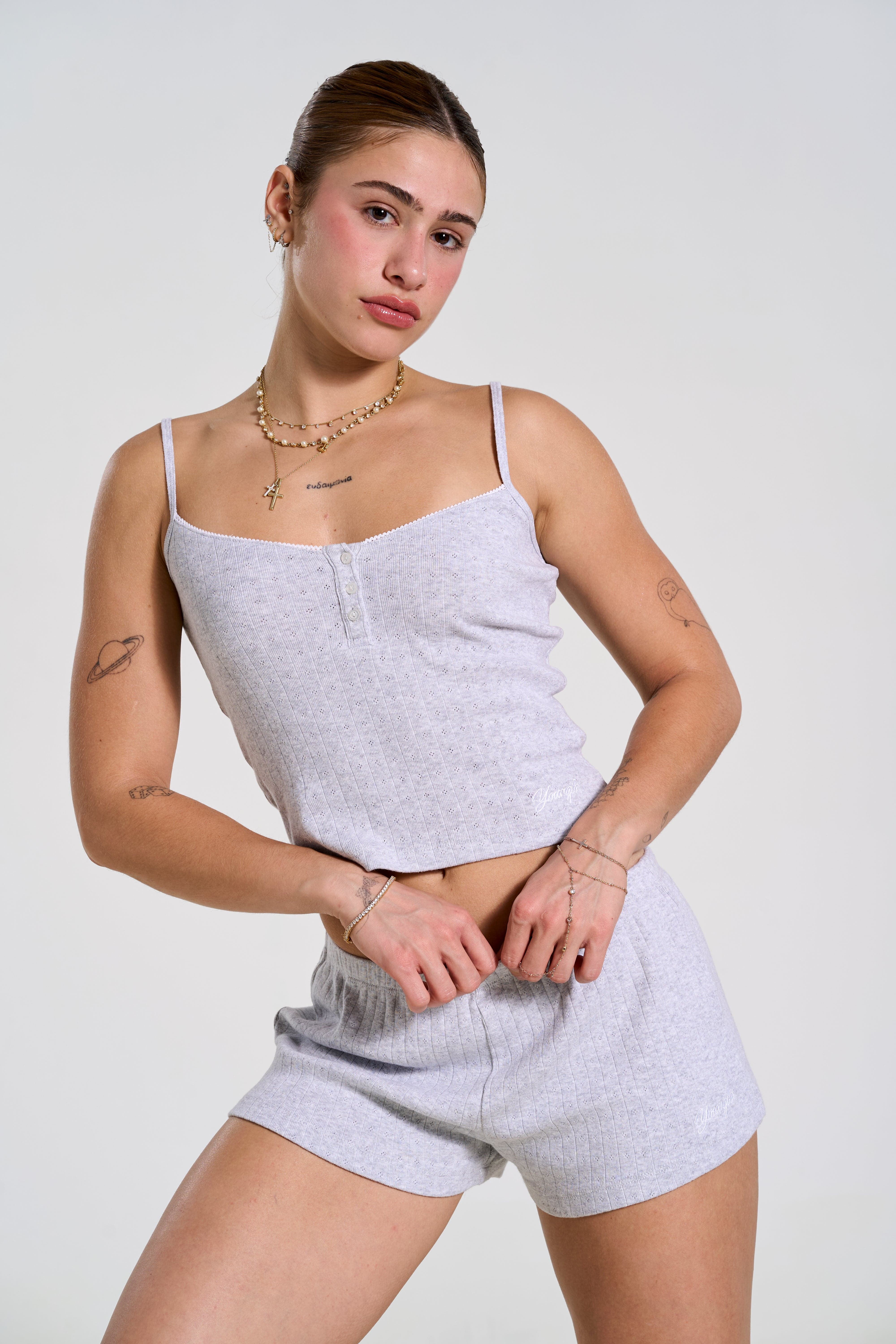 Model wearing chic cotton pajamas, demonstrating a true-to-size fit.