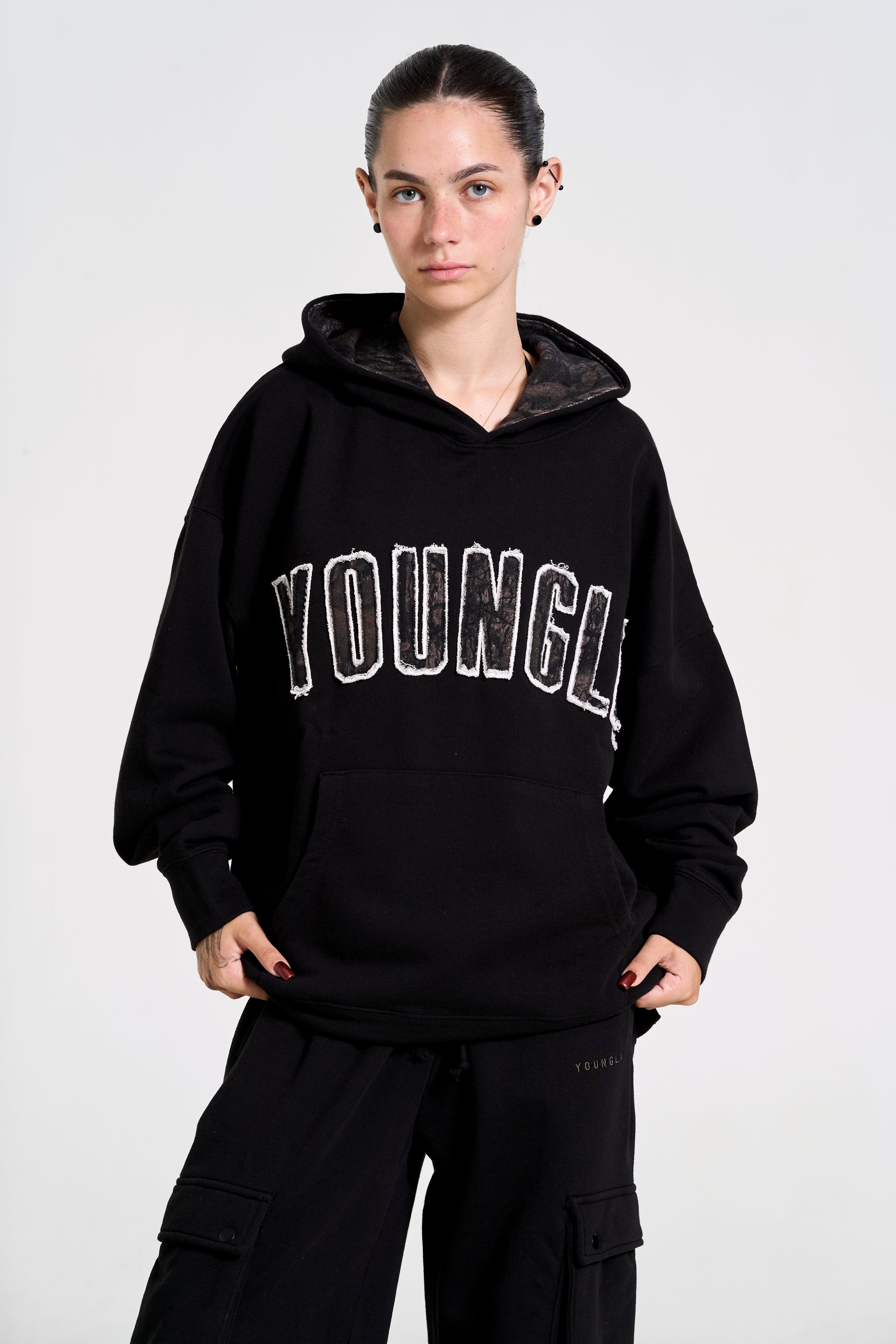 Model showcasing the oversized hoodie during an outdoor adventure.