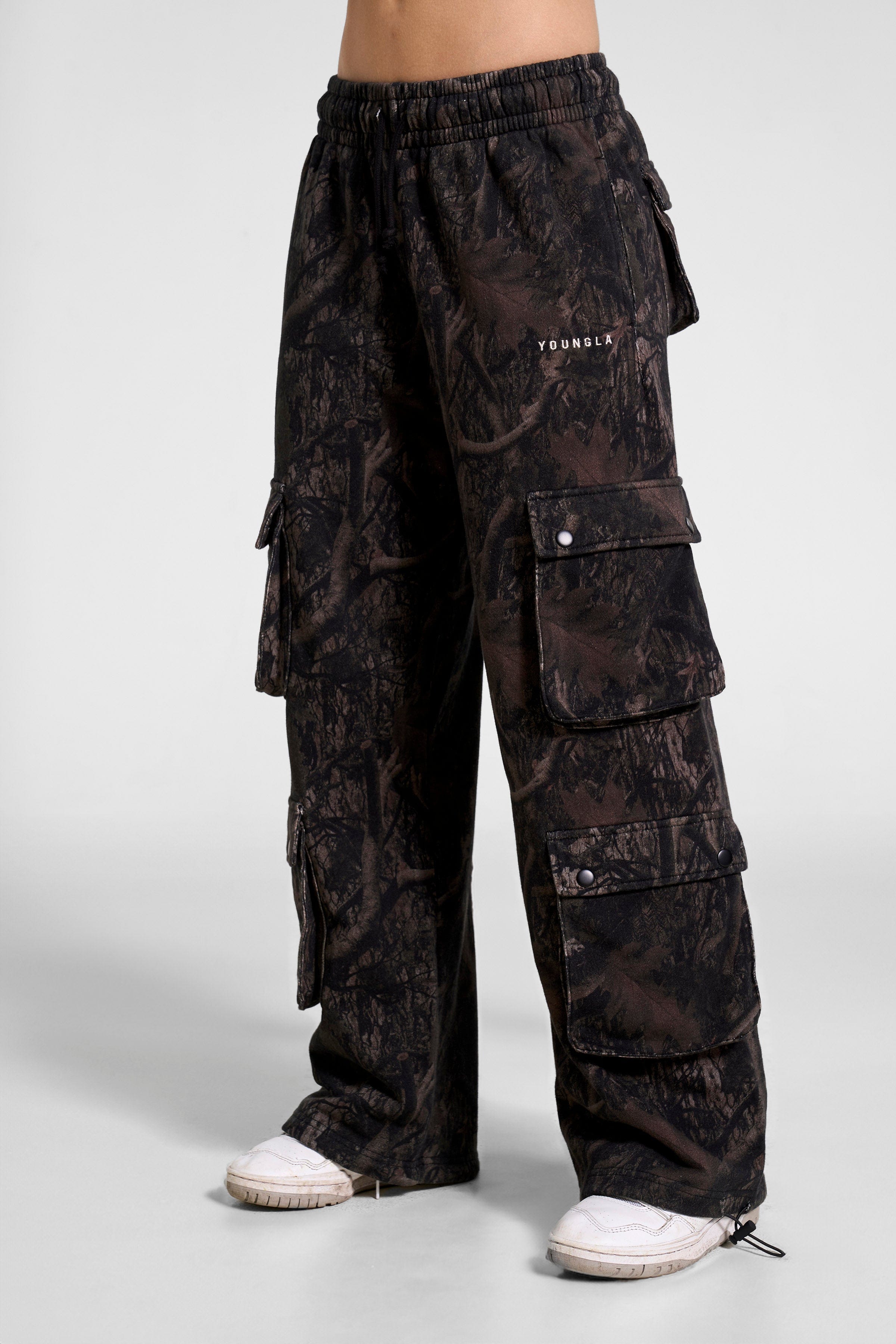 Close-up of men's cargo joggers in hunter green with cargo pockets for outdoor use