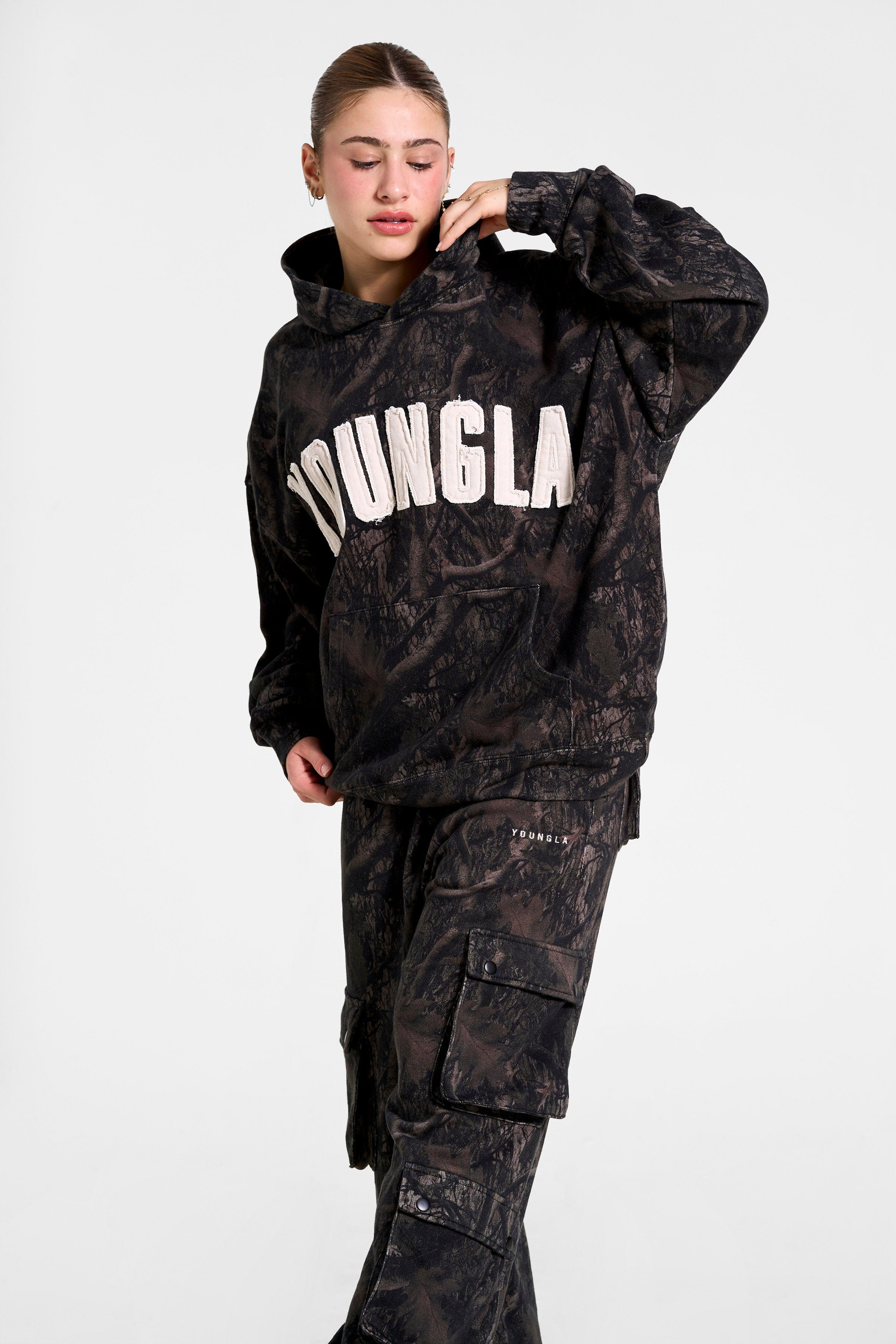 Model showcasing the oversized hoodie during an outdoor adventure.