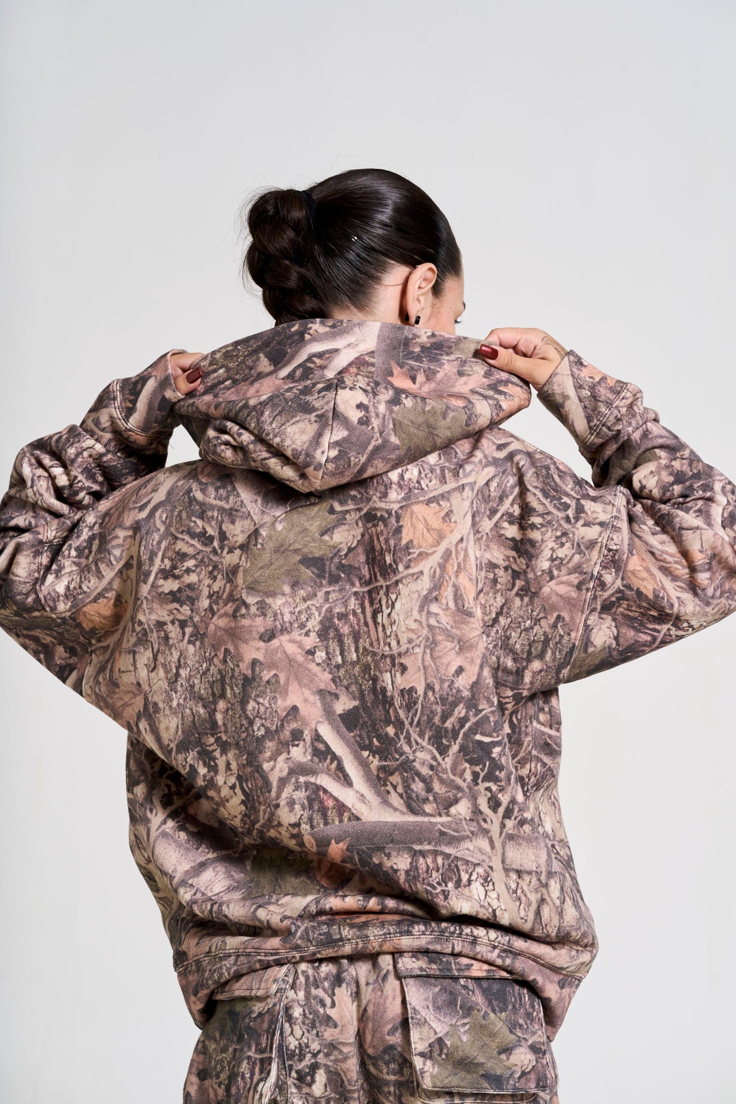 Model showcasing the oversized hoodie during an outdoor adventure.