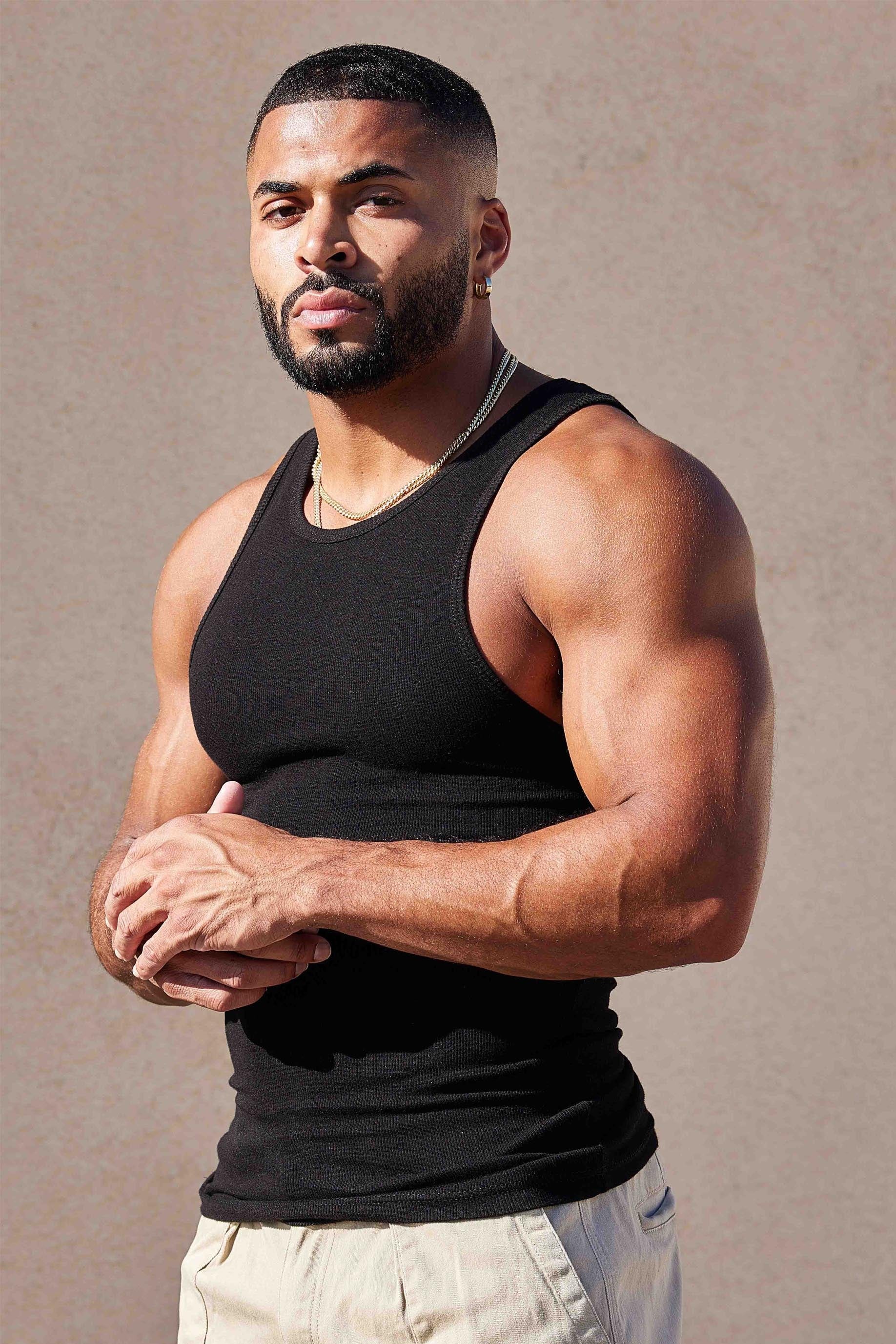 Front view of fitted white tank top worn during summer workout