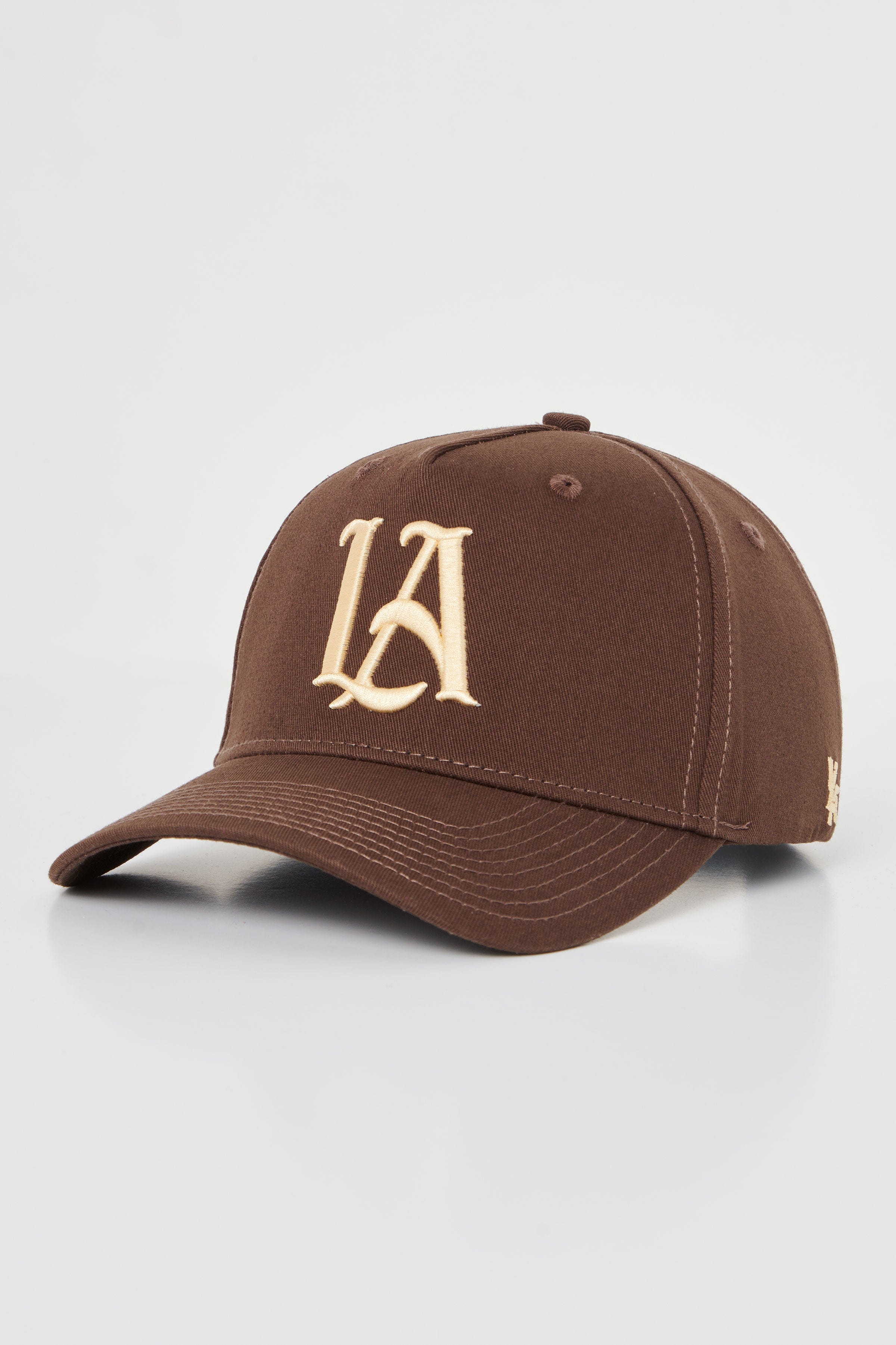 Close-up shot of the embroidered hats crown and adjustable snap closure, styled for men.