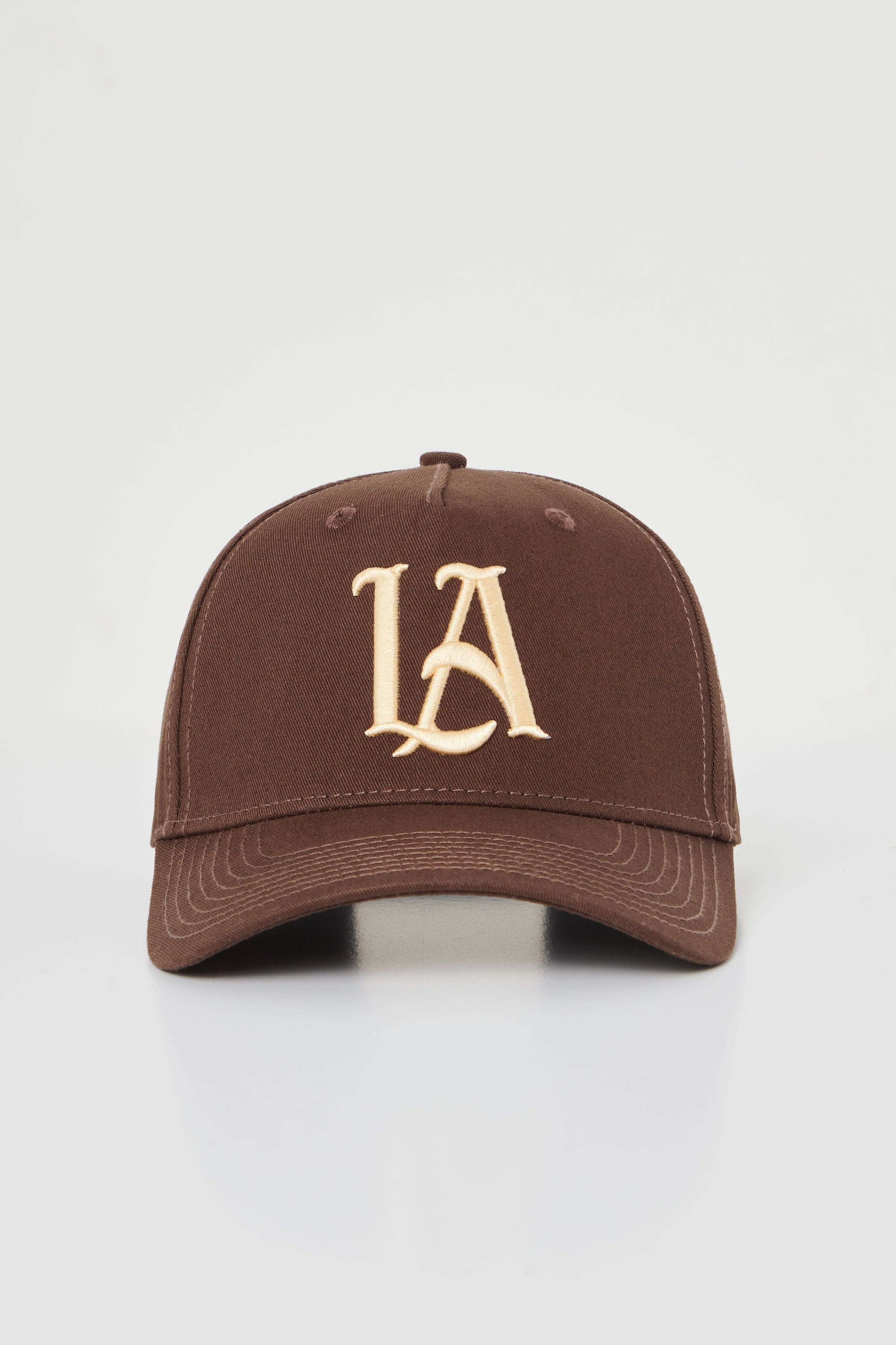 Front view of embroidered baseball hat with a structured A-Frame silhouette and detailed stitching.