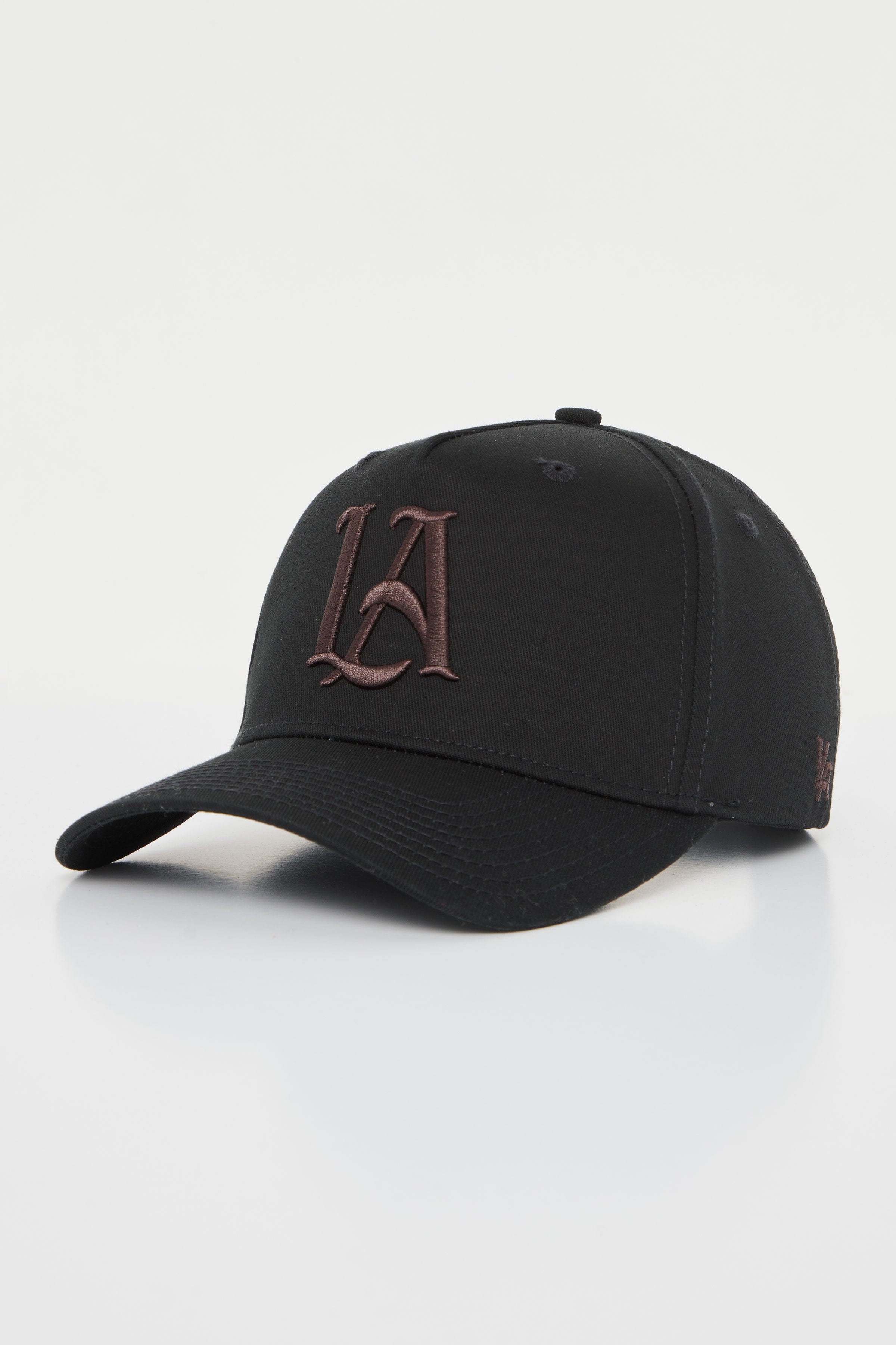 Close-up shot of the embroidered hats crown and adjustable snap closure, styled for men.