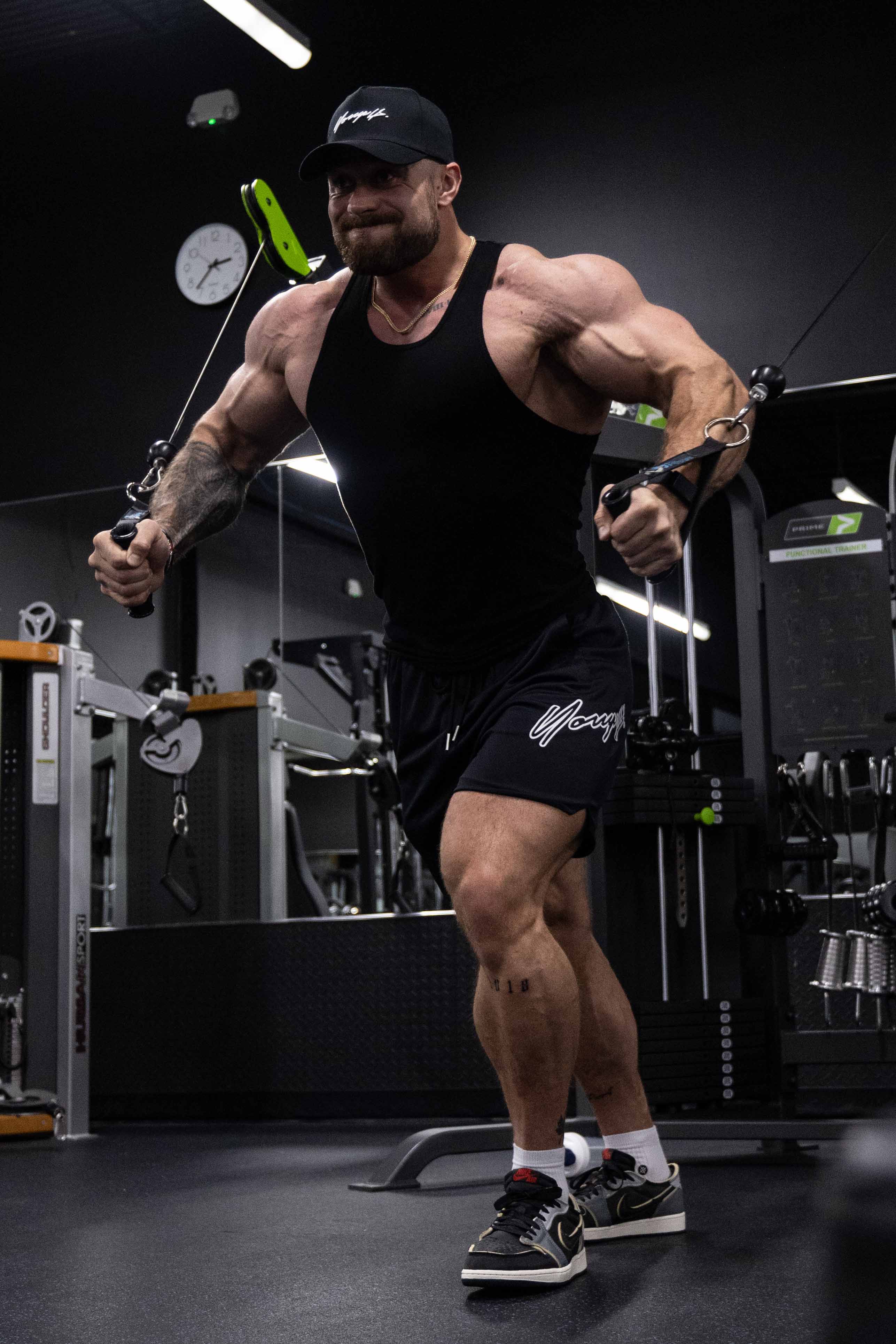 Folded black tank top from pack 1 – sleek gym-ready styling