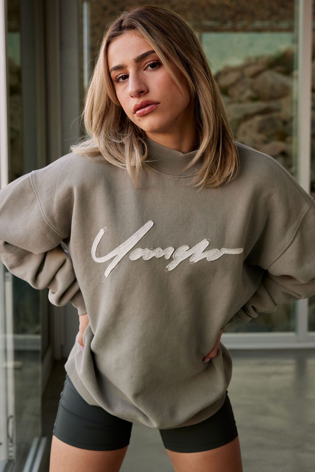Front view of the Urban Crewneck sweatshirt highlighting the bold logo and cozy terry material