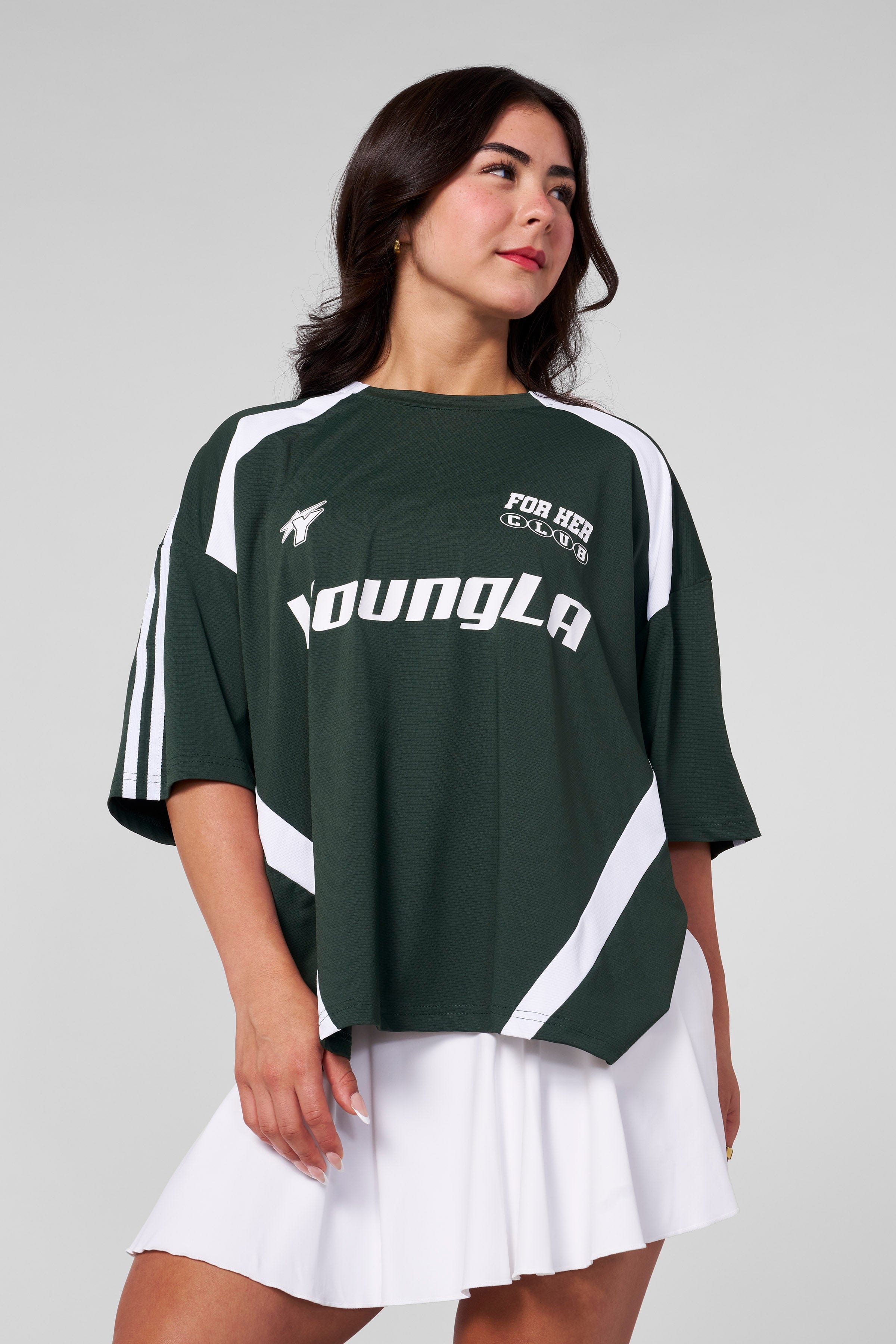 Model wearing oversized jersey outdoors near Georgia stadium