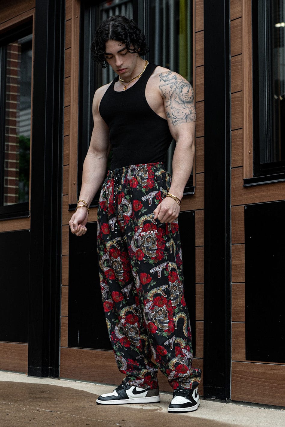 Model wearing loose-fit skull pants during a workout session, emphasizing mobility