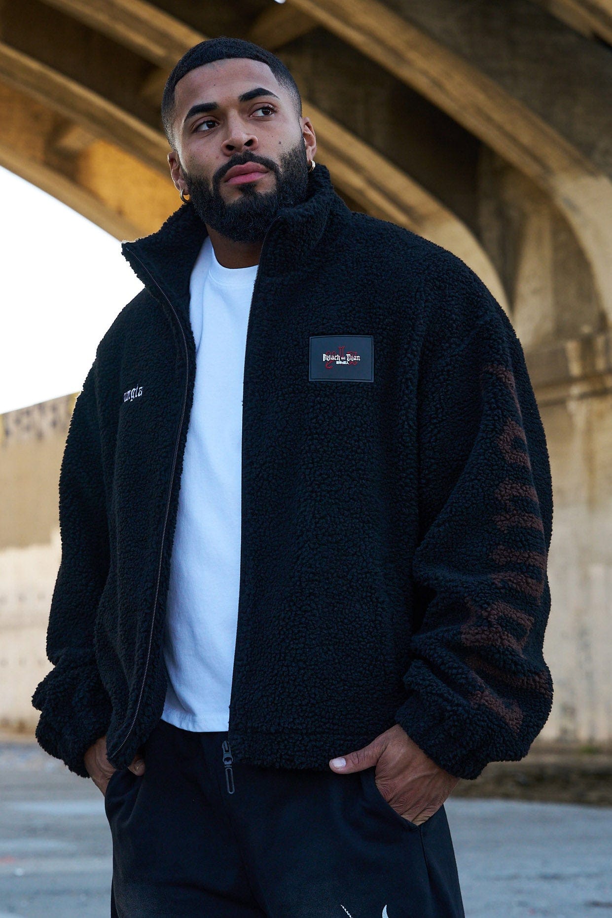 Detail shot of the cozy sherpa lining and AOT embroidery.