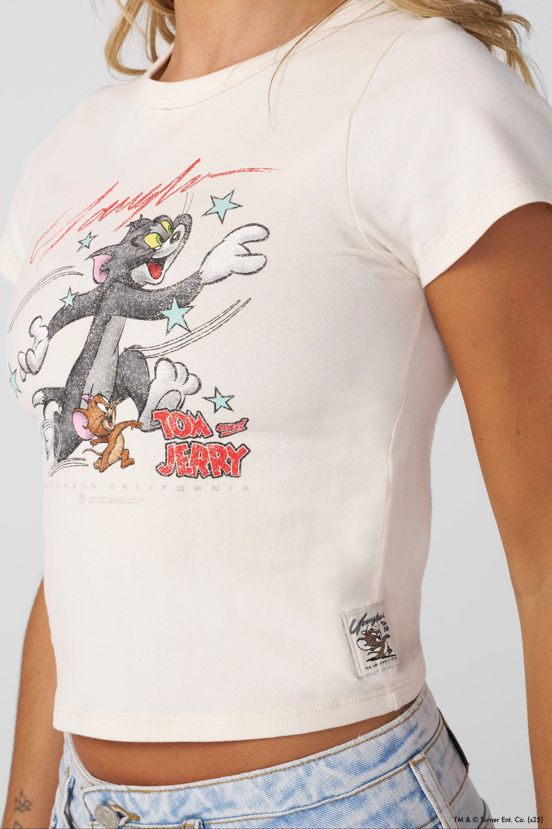 Close-up of soft fabric texture on Tom and Jerry shirt for toddlers