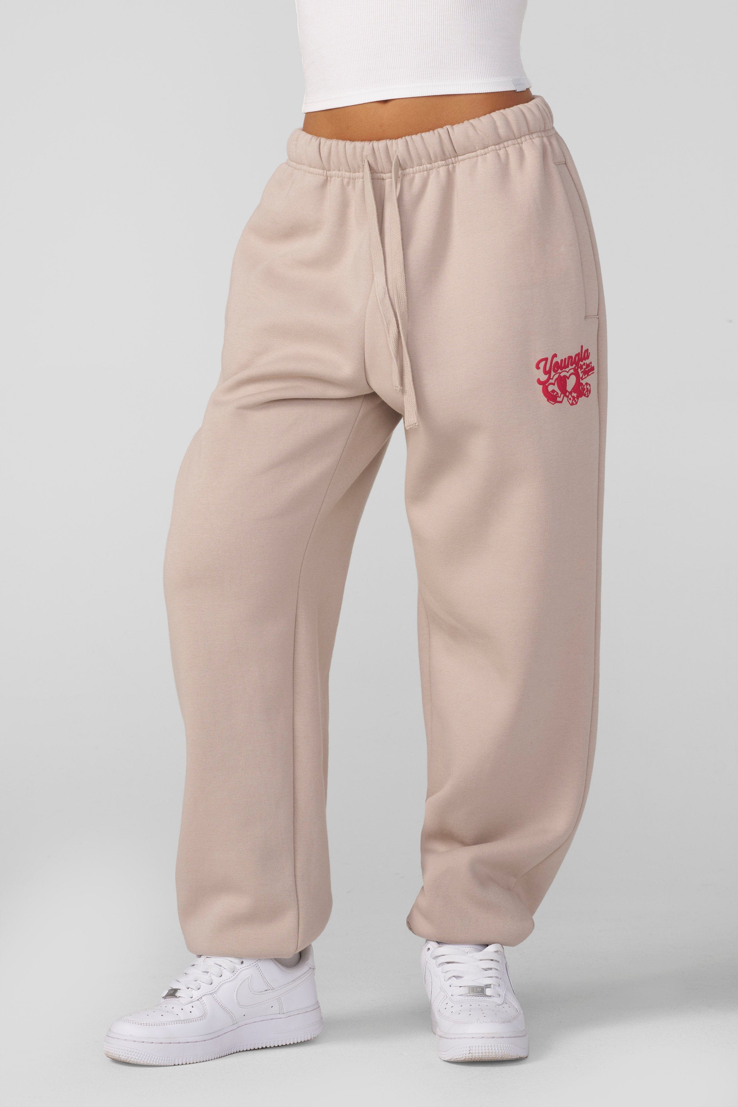 Stylish puff print detail on the black joggers, ideal for cozy days.