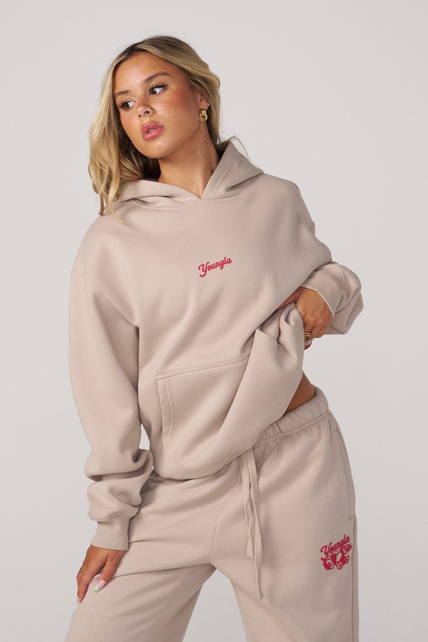Model lounging in the cozy hoodie, perfect for a relaxed day at home.