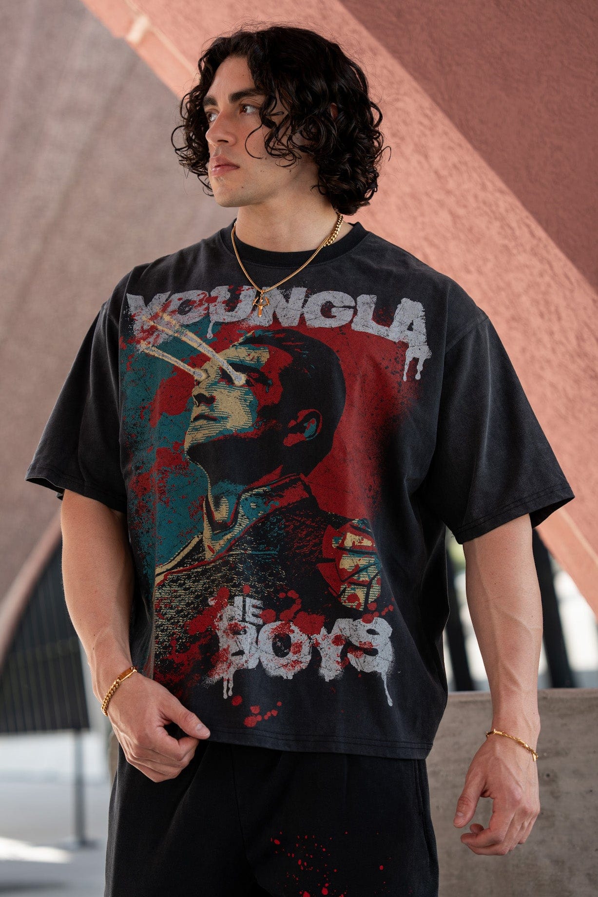 Front view of mens graphic t shirt styled for streetwear in black