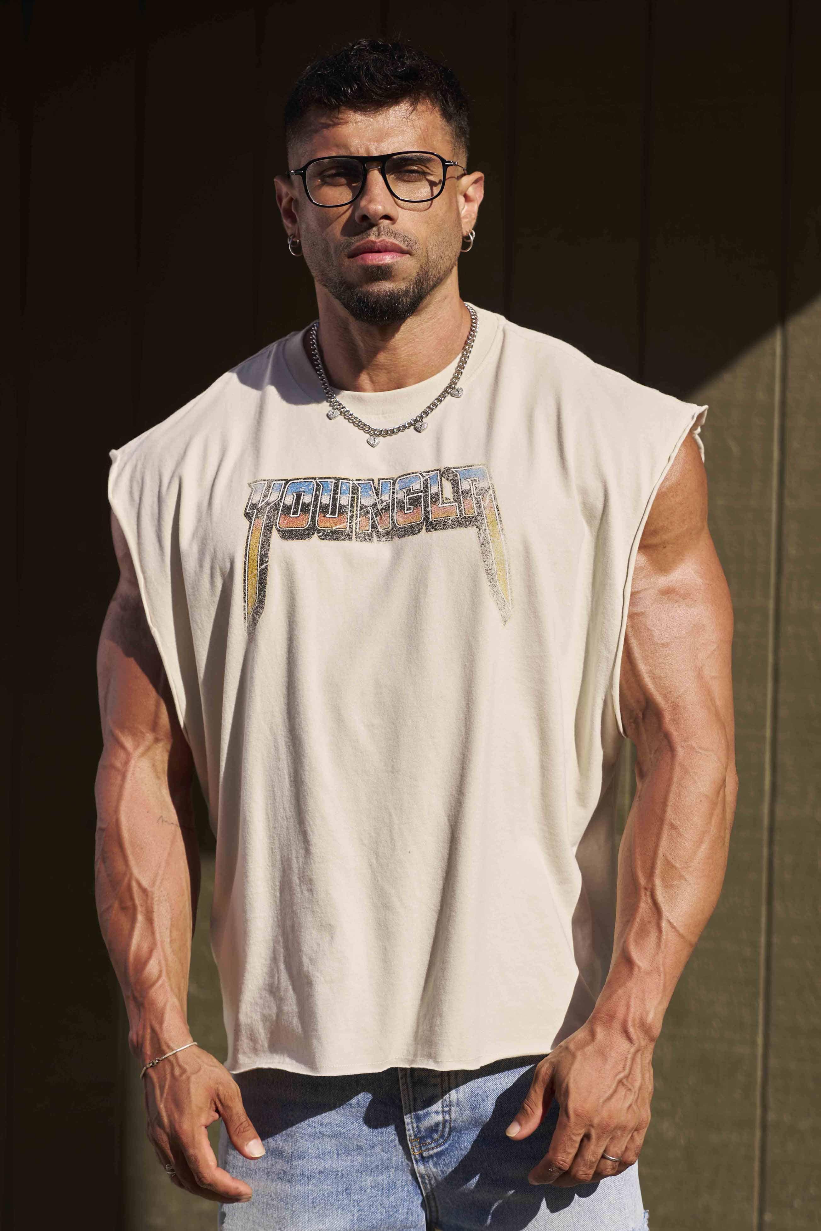 Model wearing vintage biker tank top with raw-edge armholes