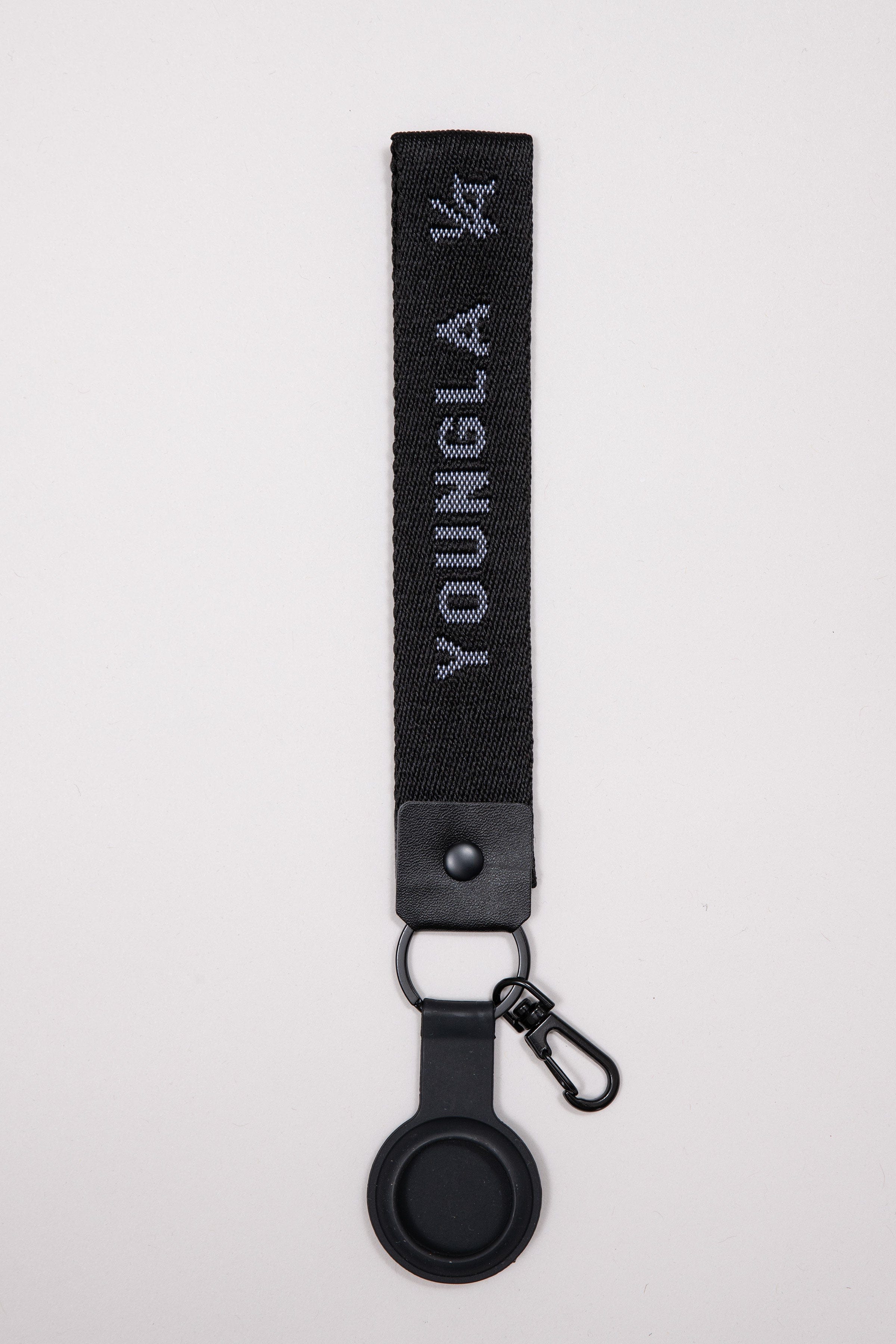 Close-up of YoungLA custom acrylic keychain in matte black finish