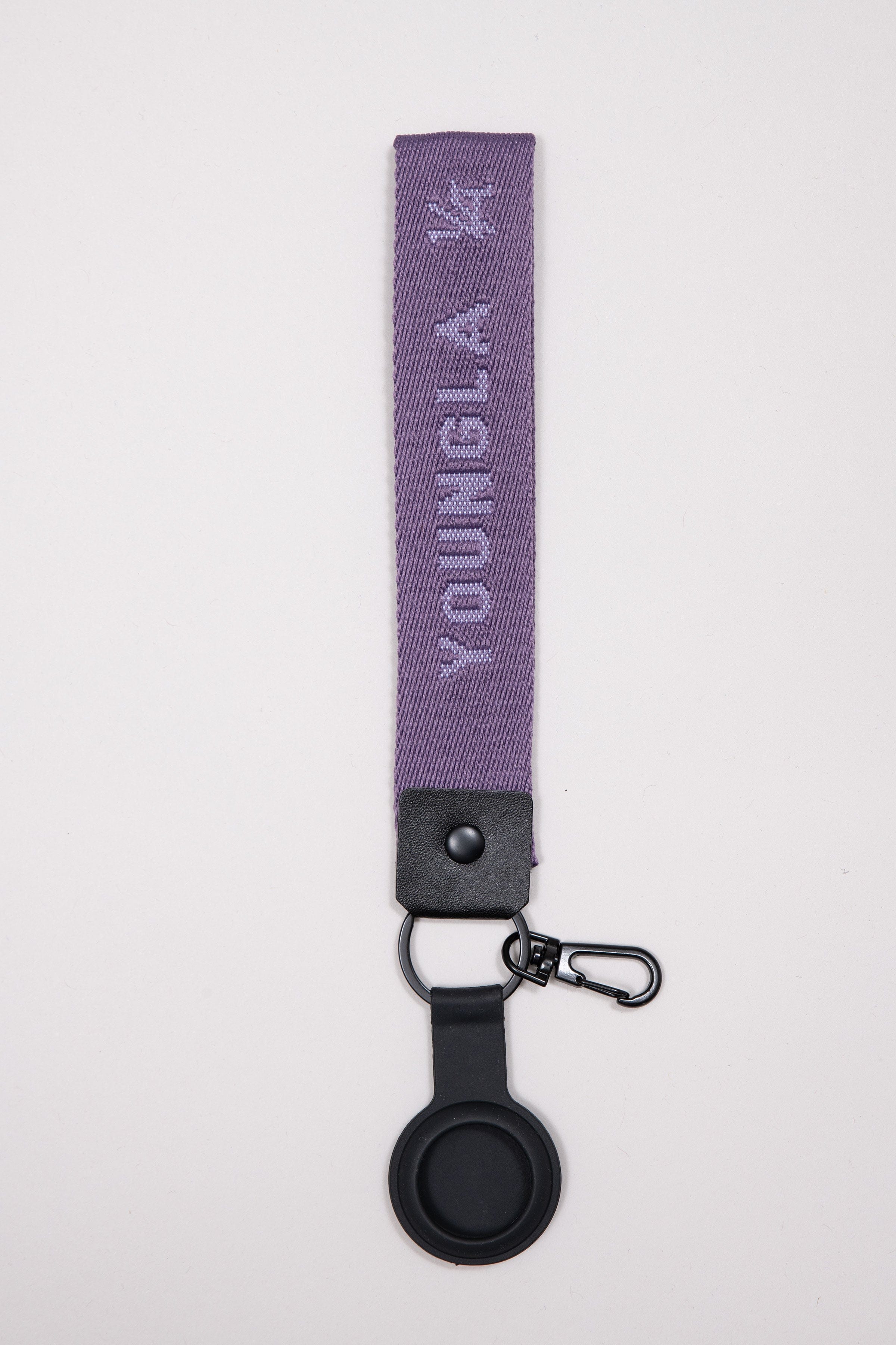 Close-up of YoungLA custom acrylic keychain in matte black finish