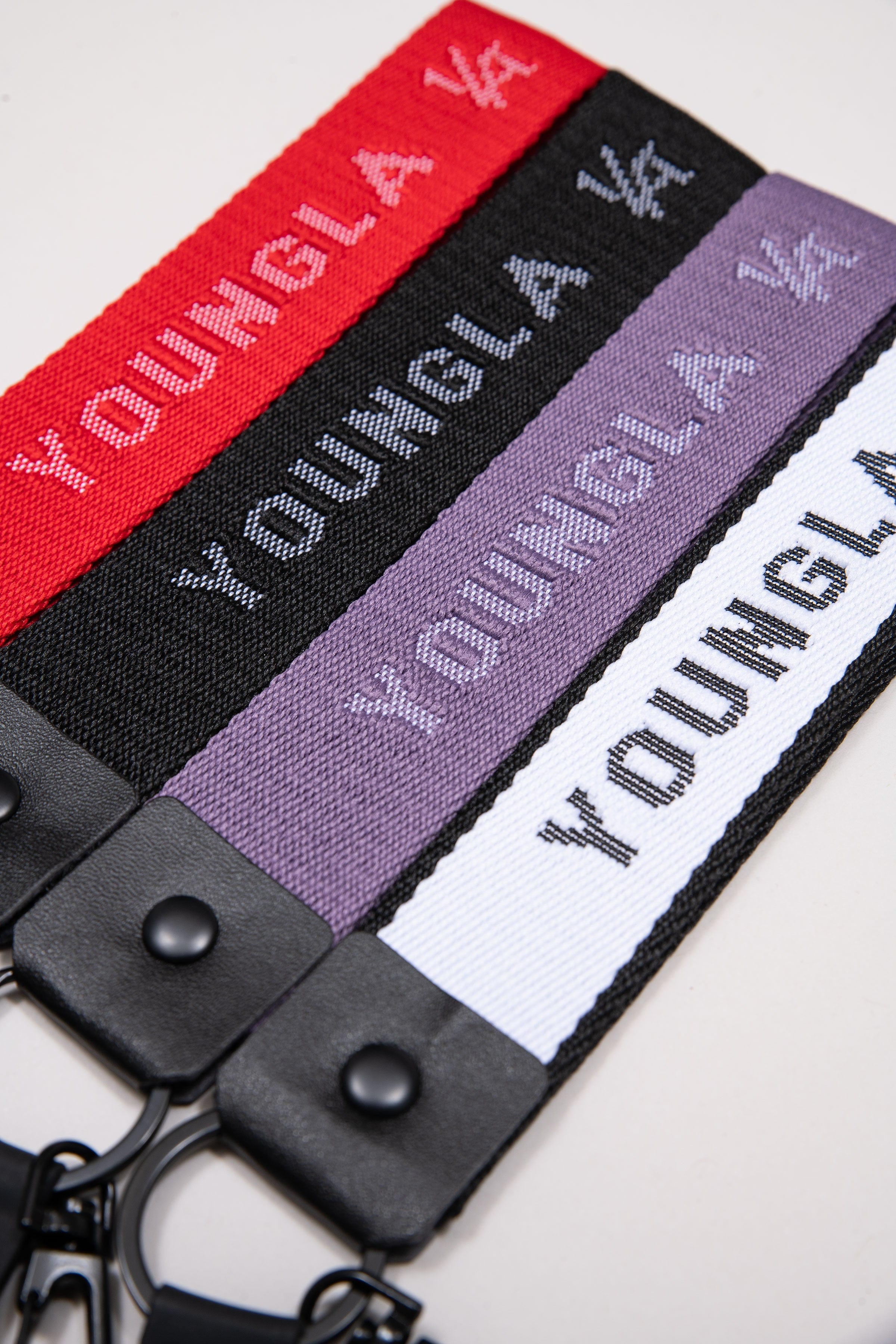 YoungLA stylish keychain clipped to a canvas backpack during London commute